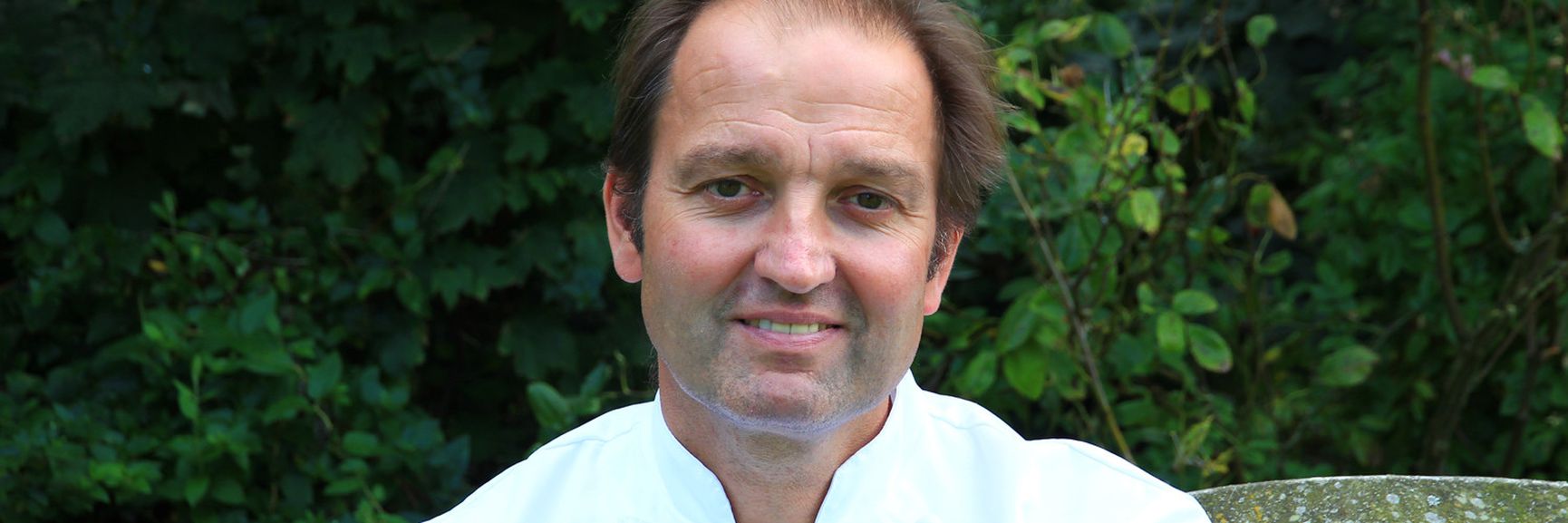 Chef Galton Blackiston in crisp white chefs coat