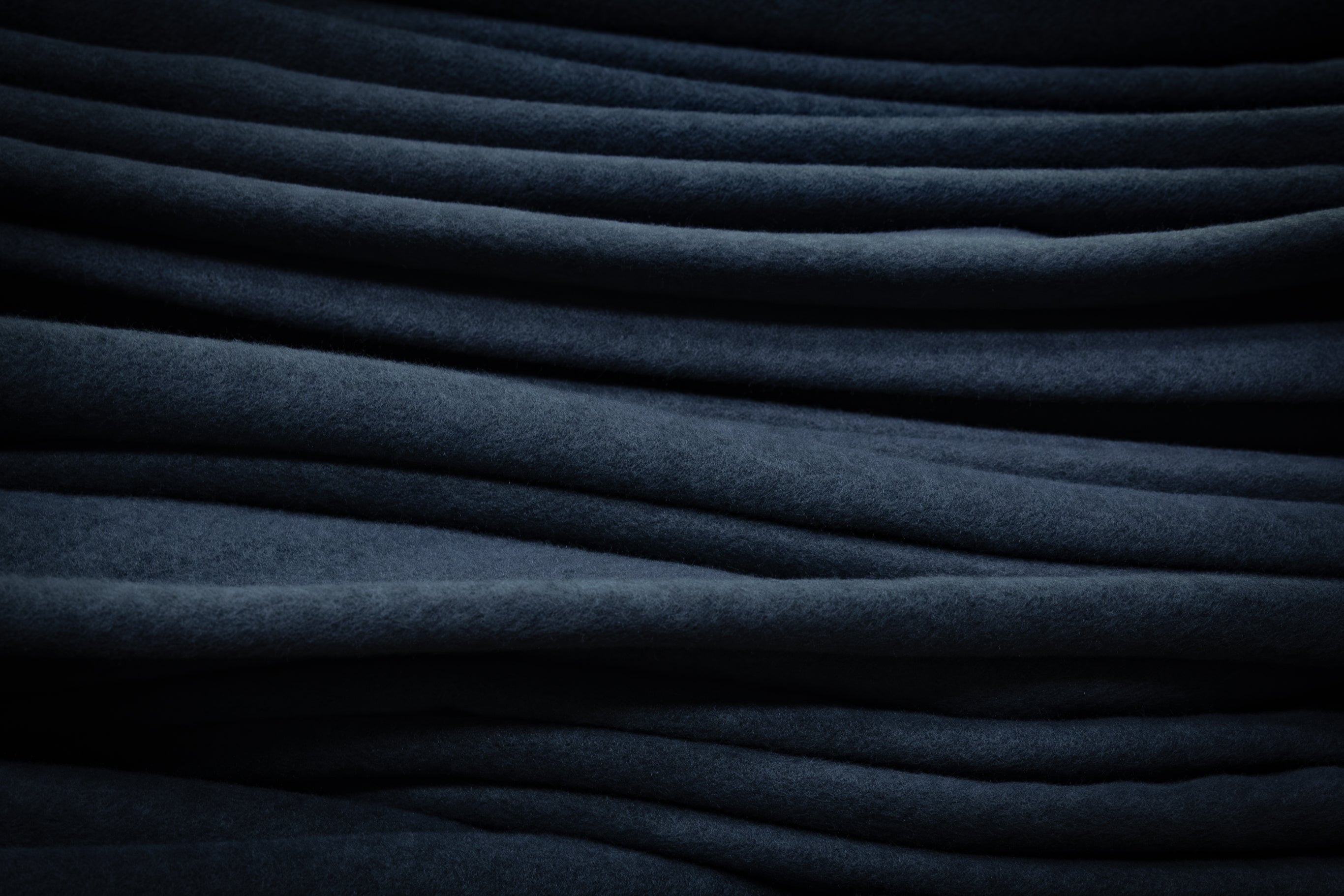 Dark blue Schöffel suede fleece with soft textured surface and folds