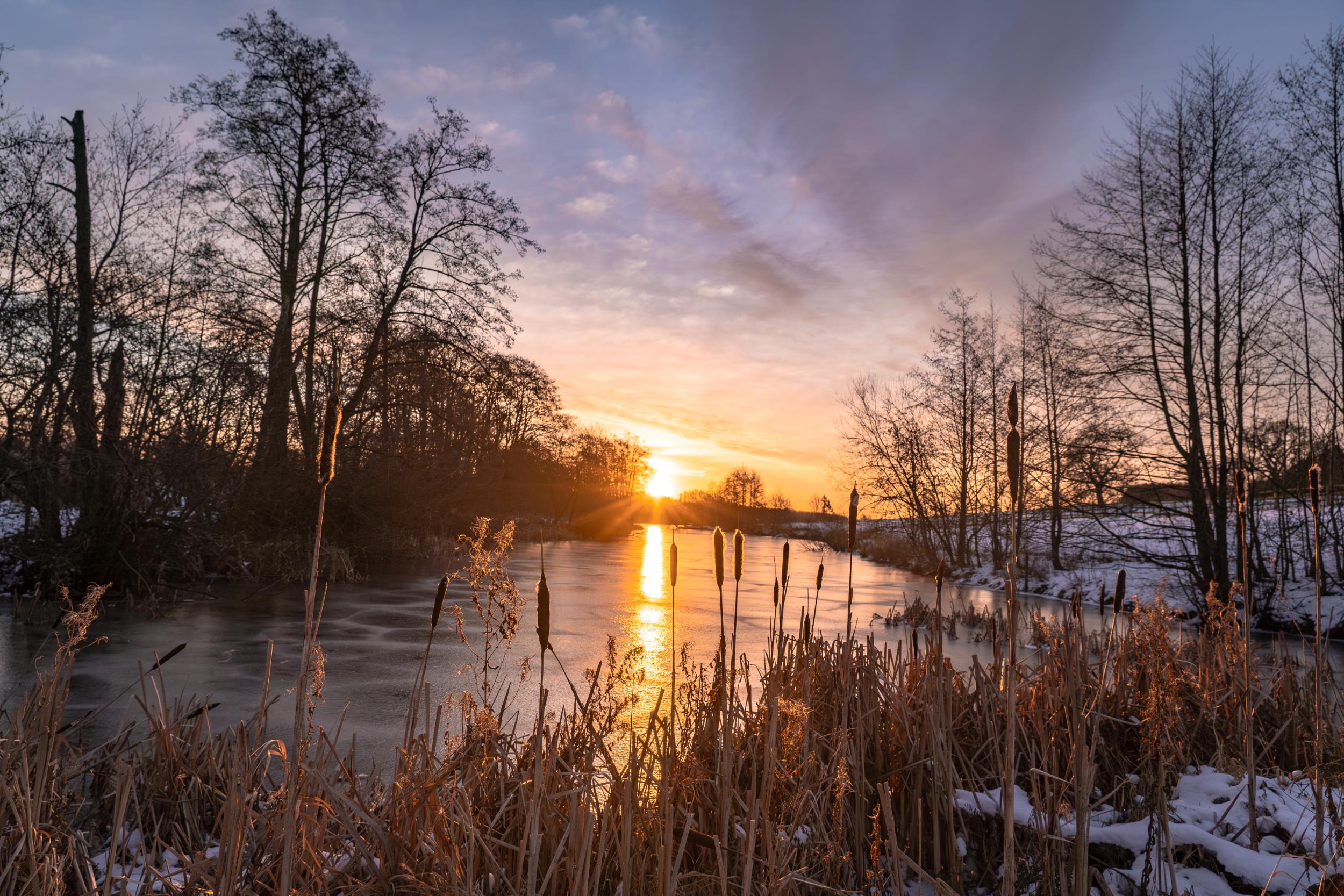 Serene winter sunset over frozen river, 2024 Ruralist highlight
