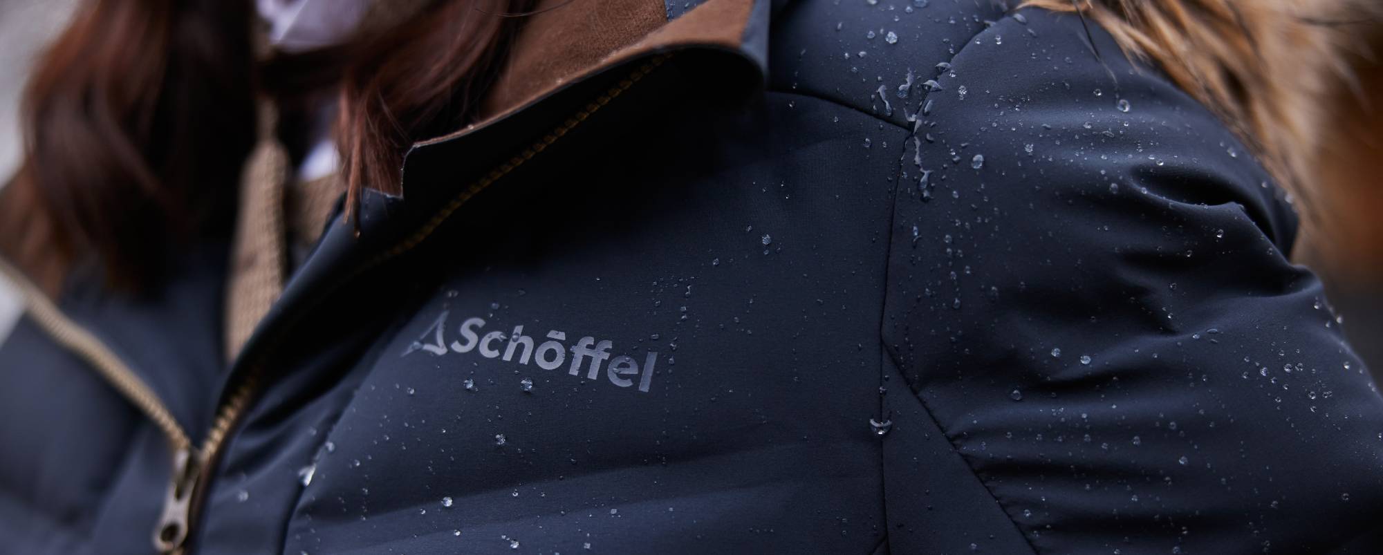 Dark navy Schoffel puffer jacket with down insulation and quilted texture