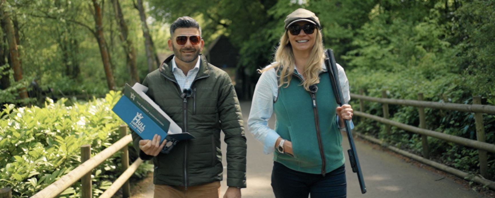 Man holds Bull logo box at Jodie Kidd and Ed Solomons clay shooting