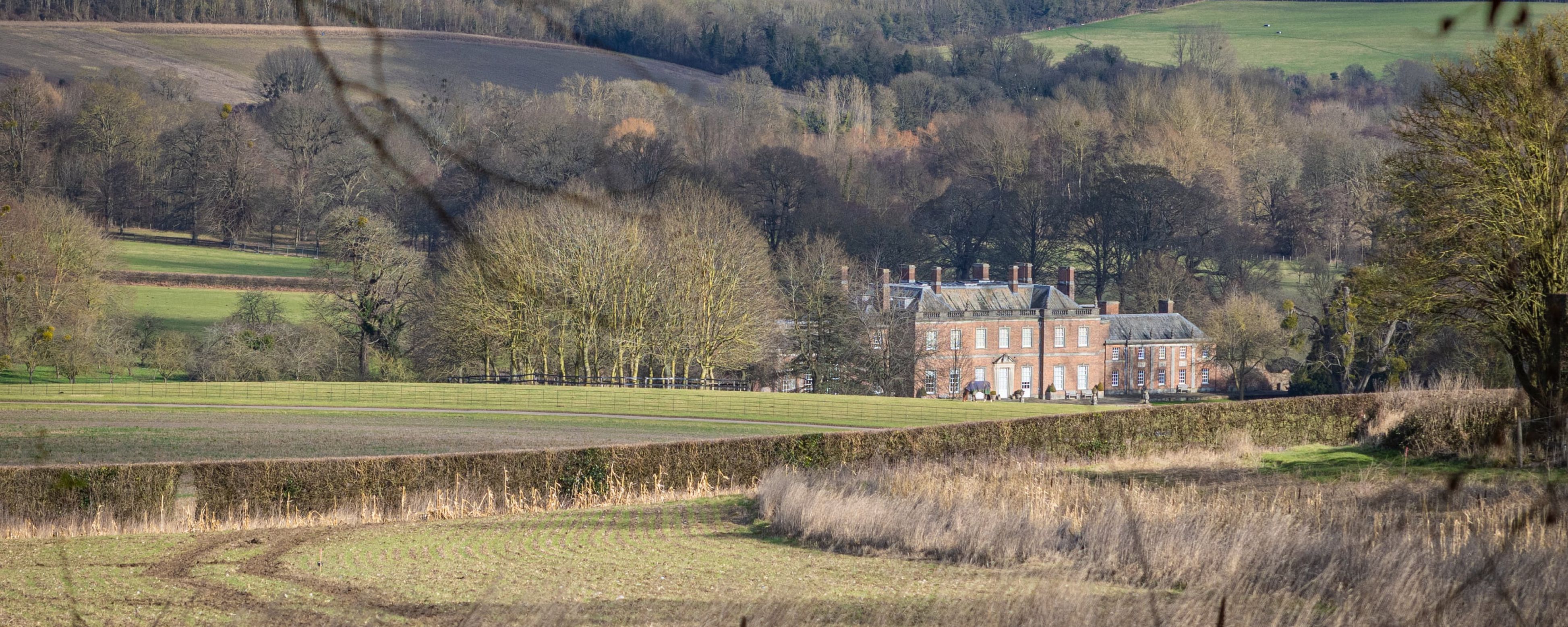 Godmersham Park manor house amid rolling green hills