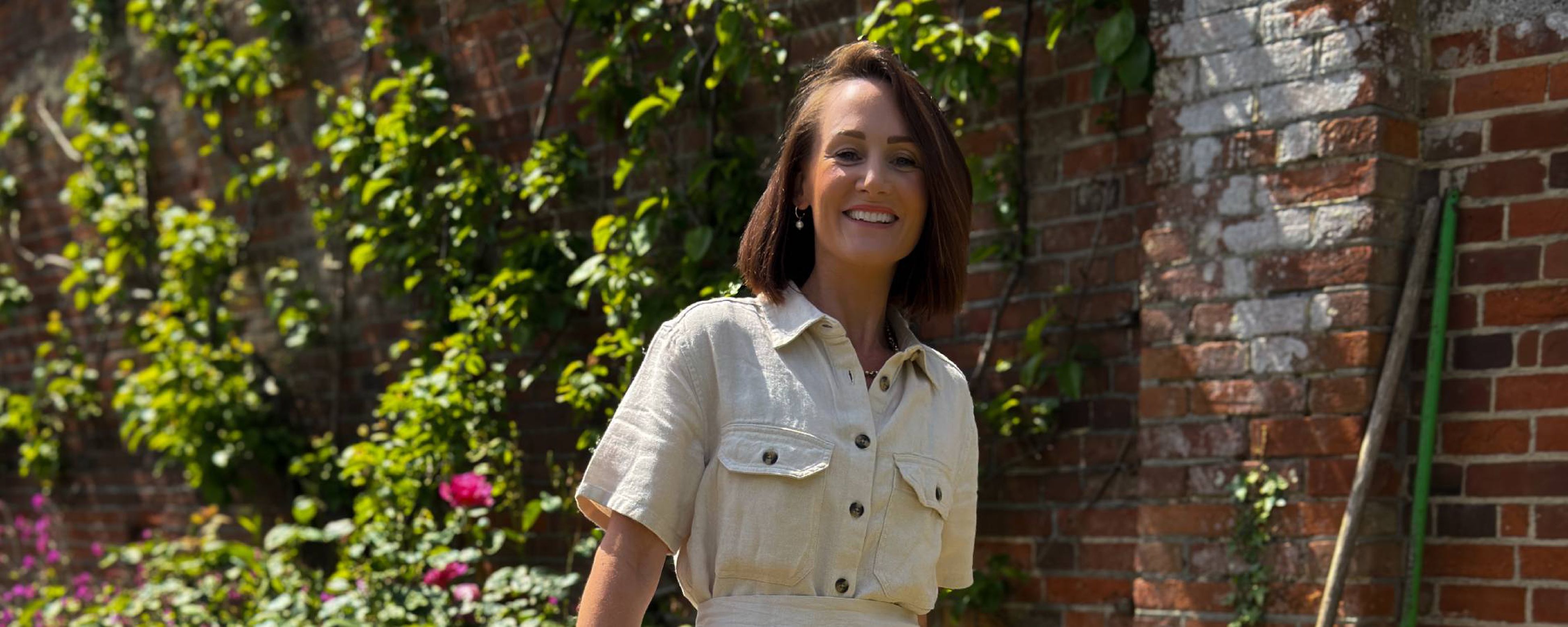 Summer style: woman in cream denim shirt dress with short sleeves