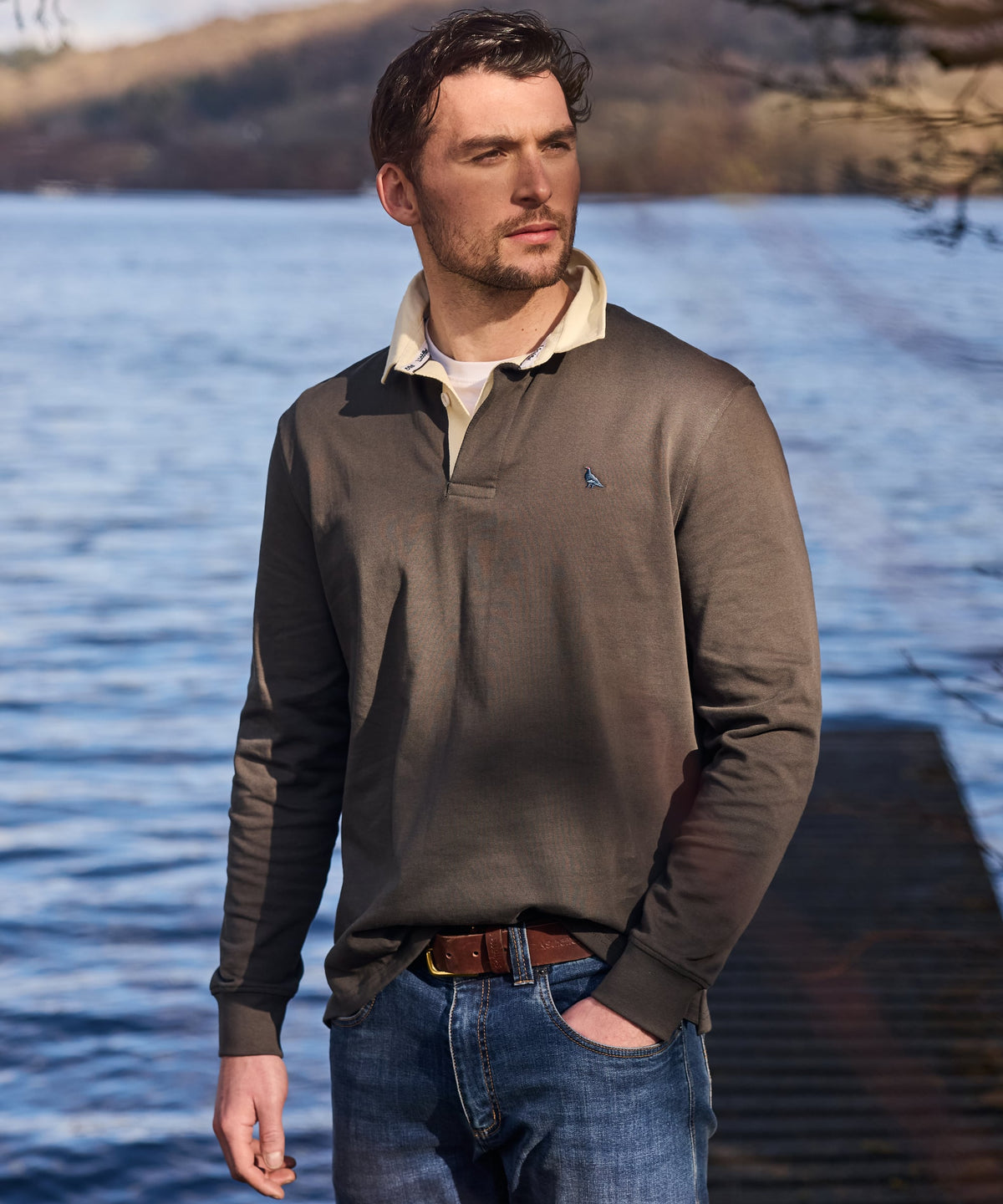Brown long-sleeved porthallow rugby shirt in peat green with cream collar and small chest