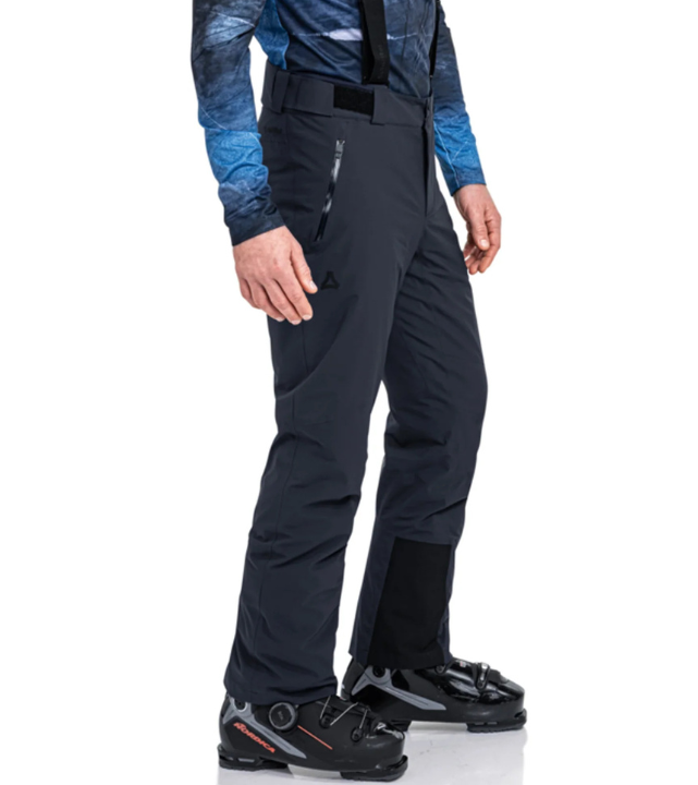 Person wearing navy ski pants on a white background