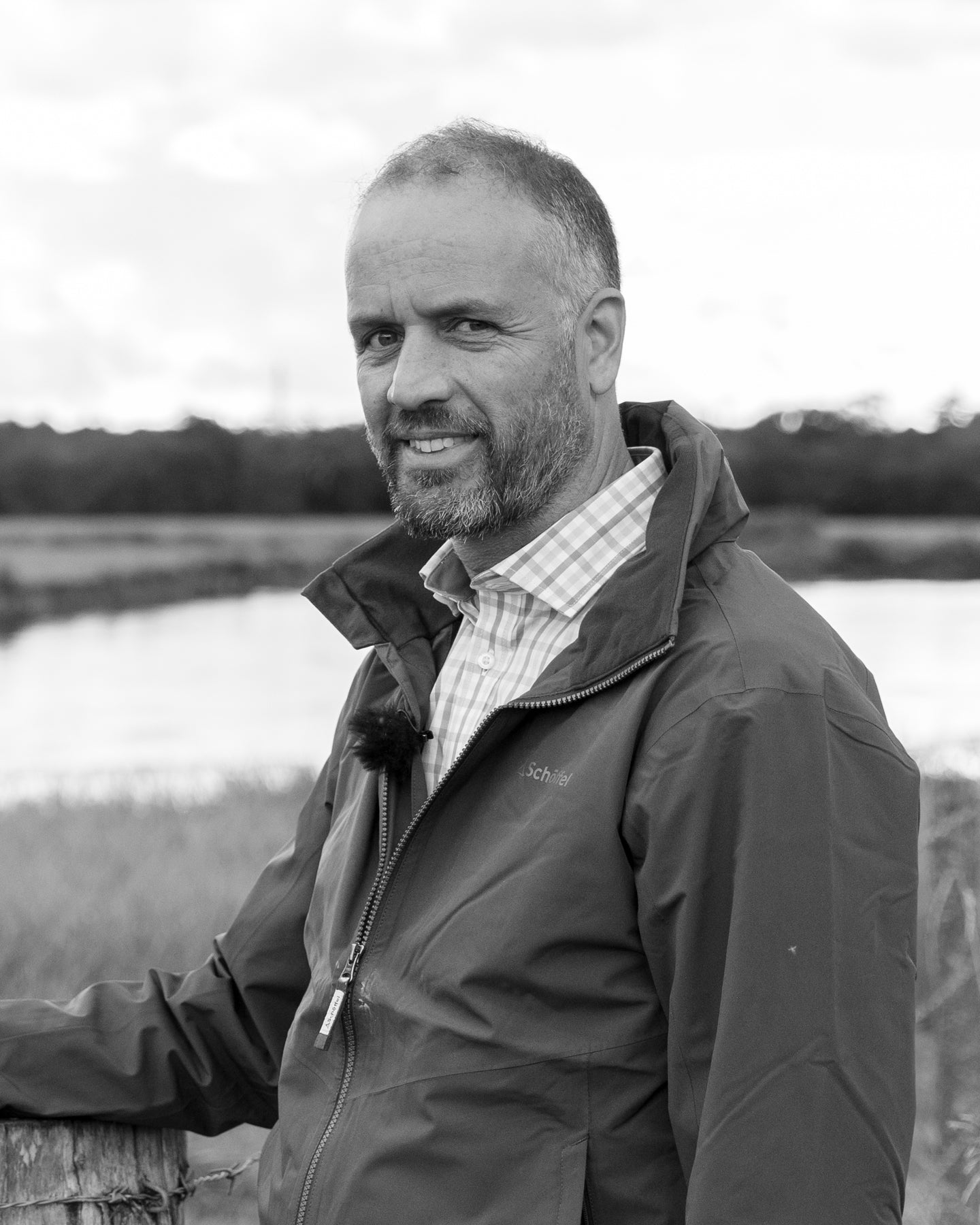 Rupert Brewer standing outdoors in a field wearing a jacket.