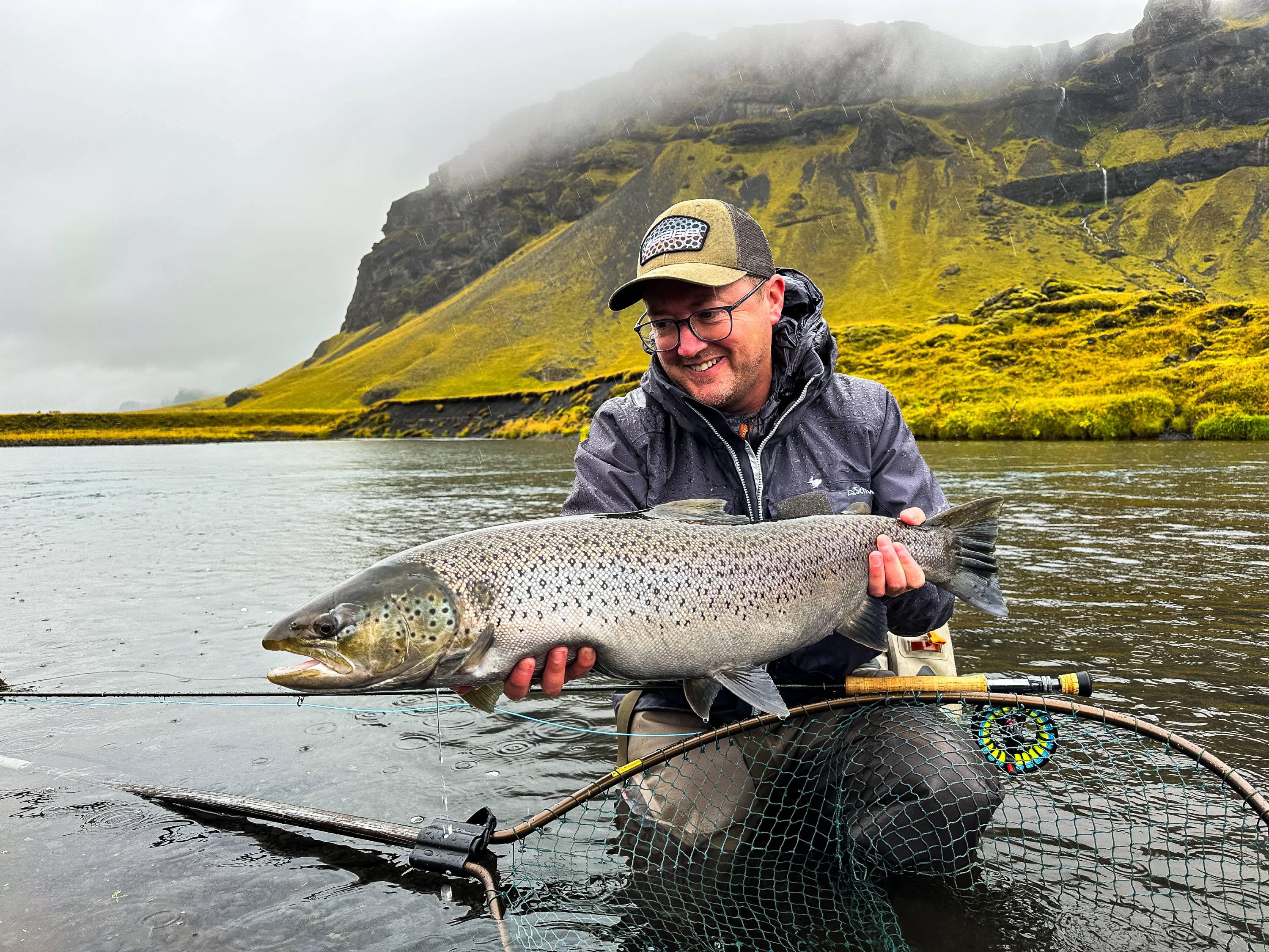 Steff with a stunning Icelandic sea trout, and the Salar II Wading Jacket keeping him dry.