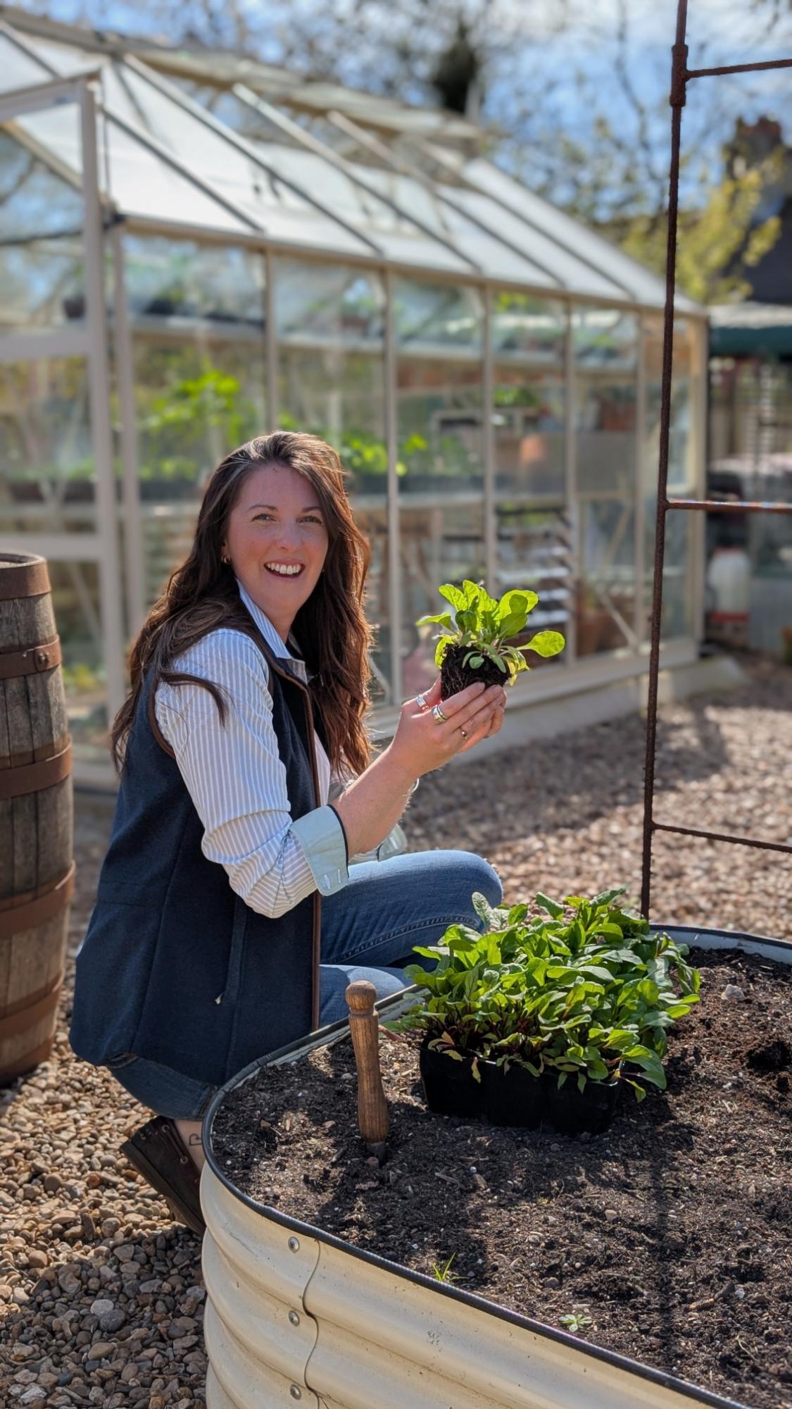 Woman tending to plants in a garden