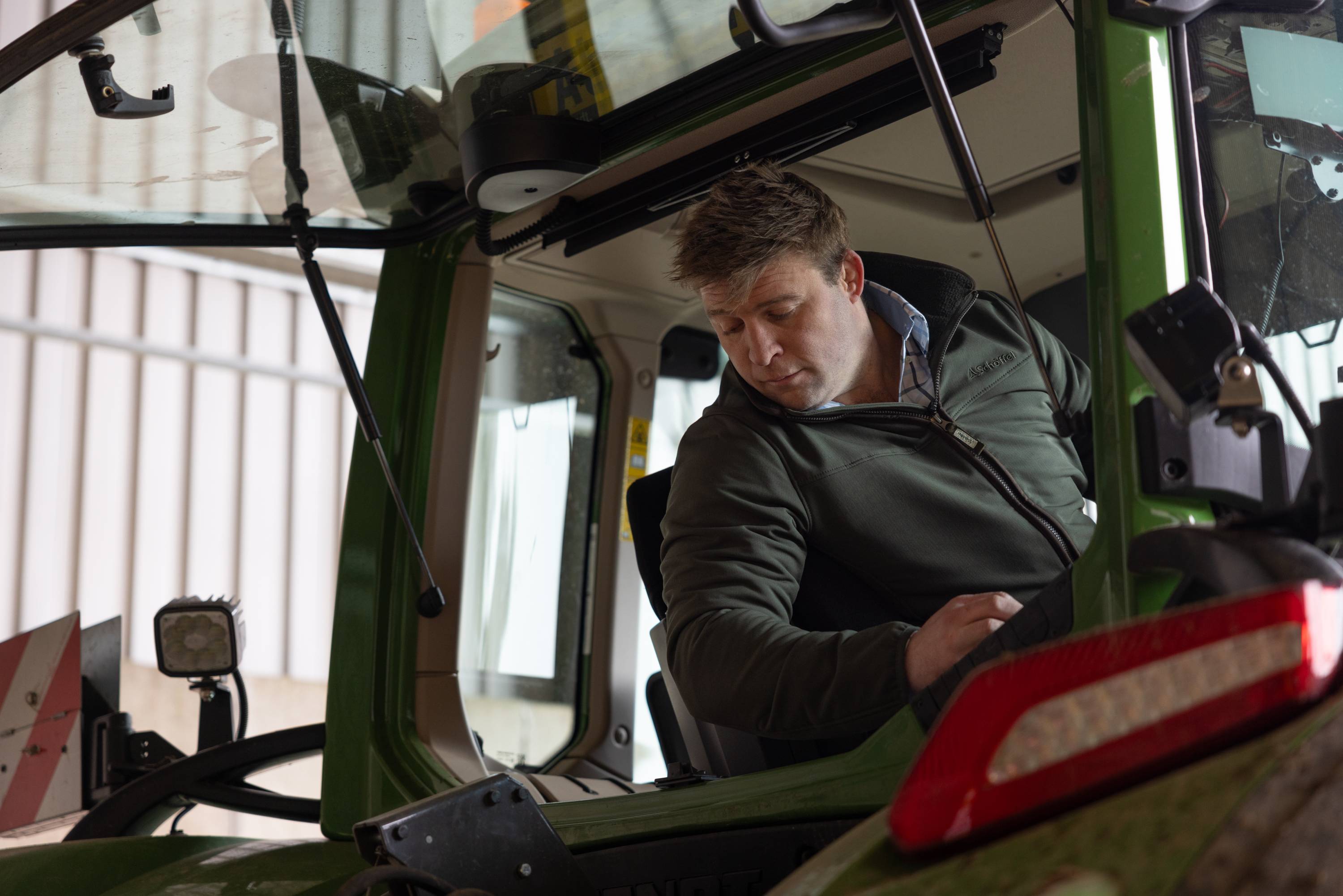 A person sitting in a tractor