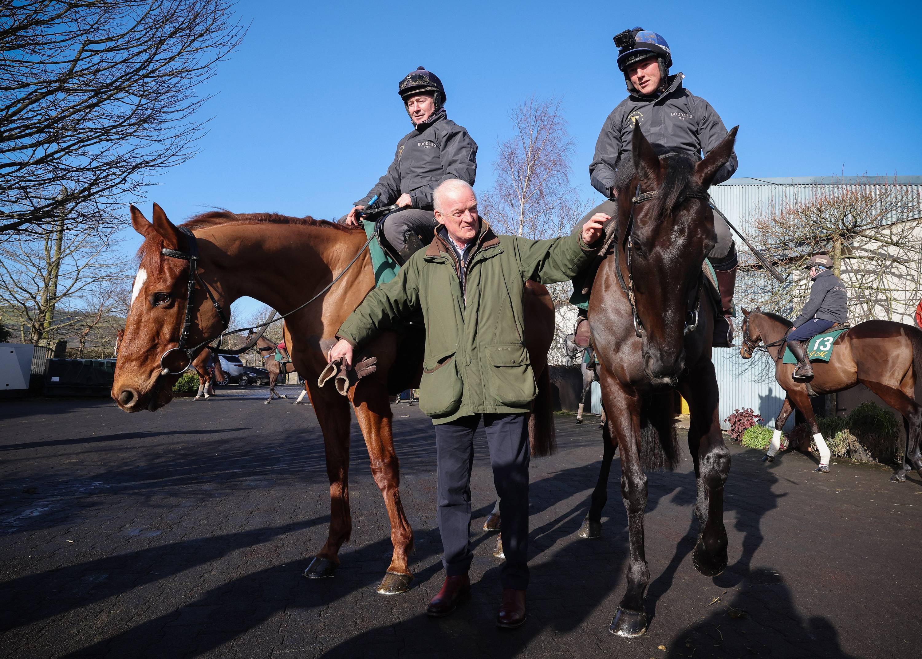 A group of people riding horses