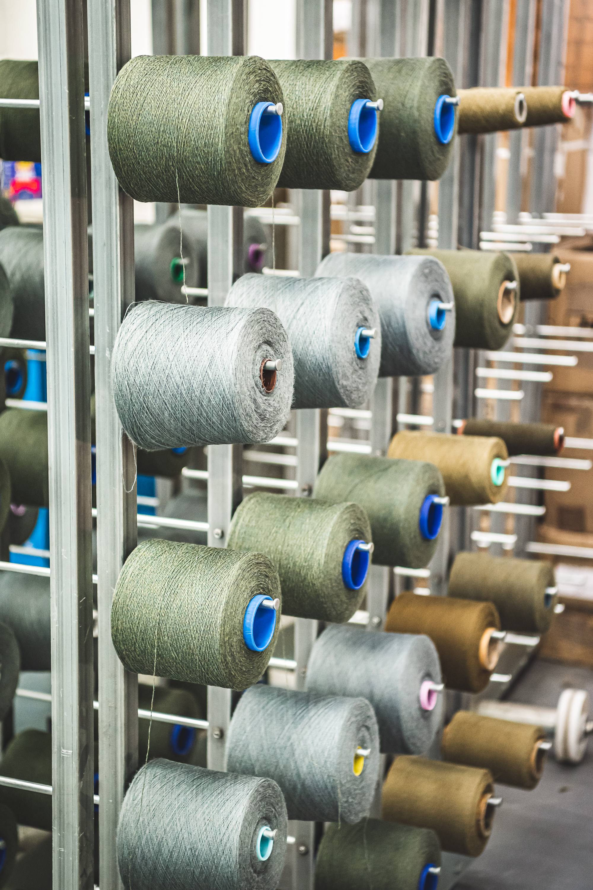 An image showing the spinning, twisting and winding process of making tweed.