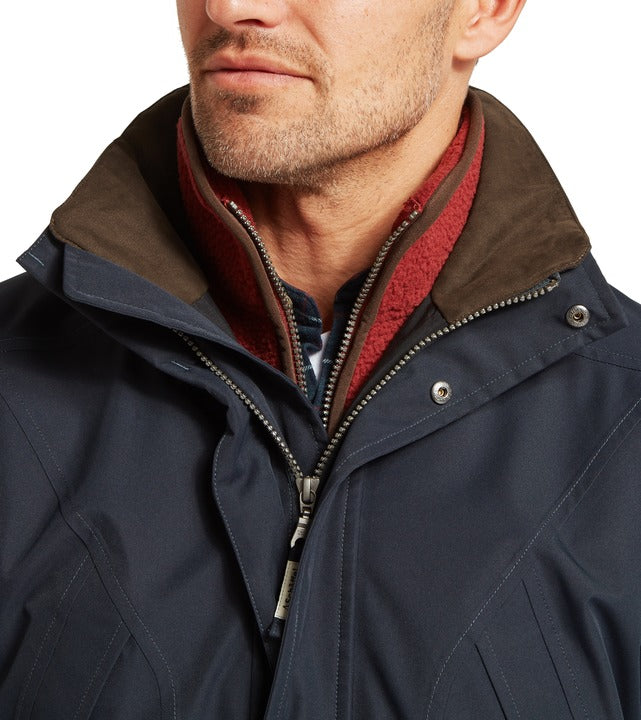 Schöffel Barrow men's country coat in navy, close-up of contrast collar with waxed-effect trim and burgundy fleece lining, popper and zip fastening