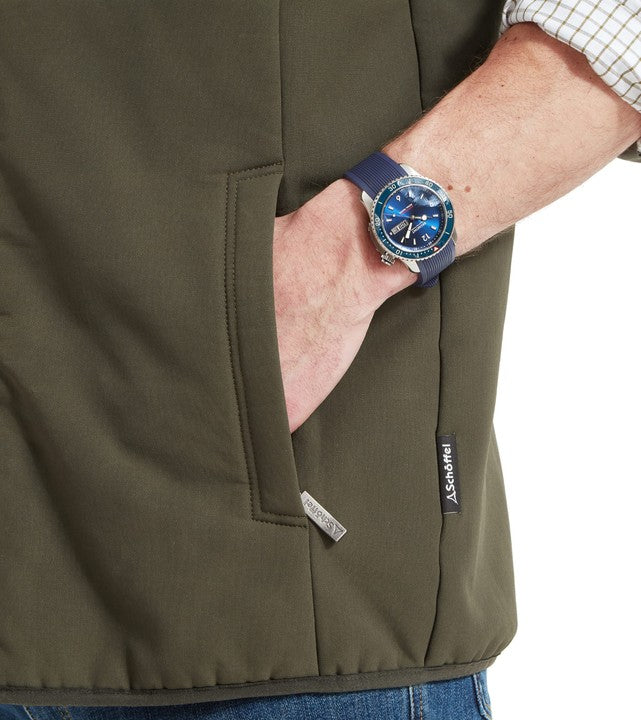 A closer look at the pocket detail on the Schöffel Belton Gilet in Green, worn with a check shirt