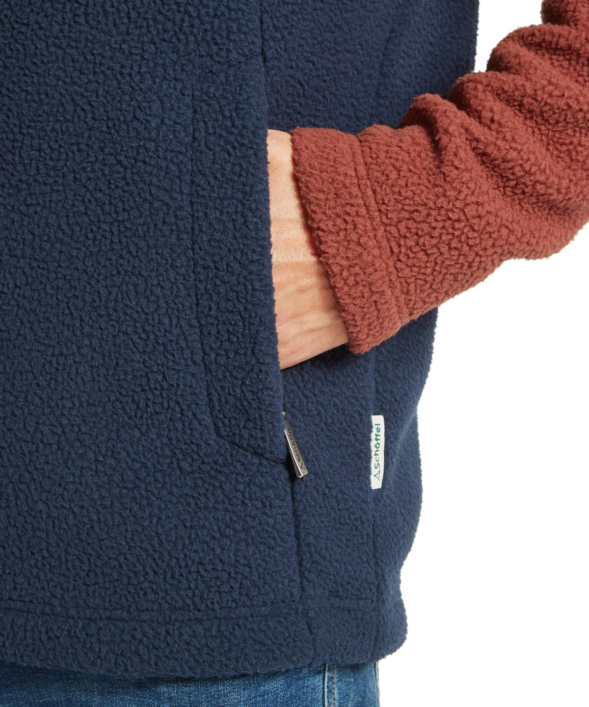 Berkeley Retro Fleece navy blue fleece vest with rust ribbed sleeve cuff and white brand tag