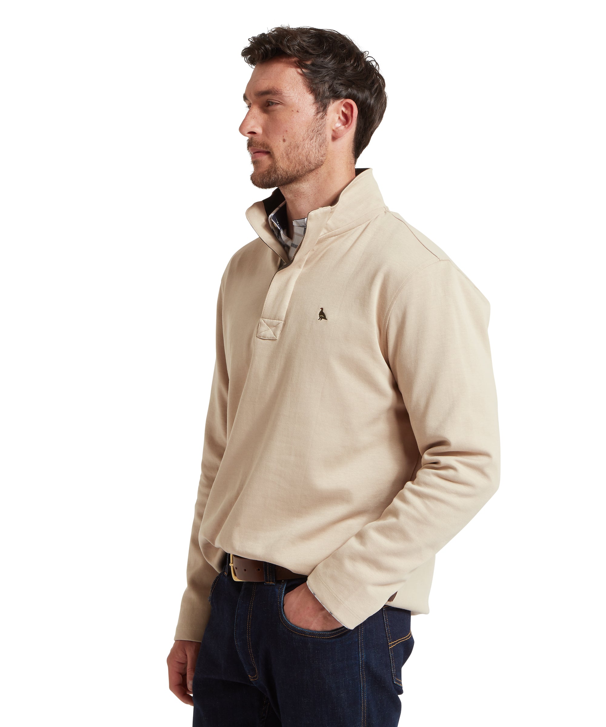 Man wearing a beige sweatshirt on a white background