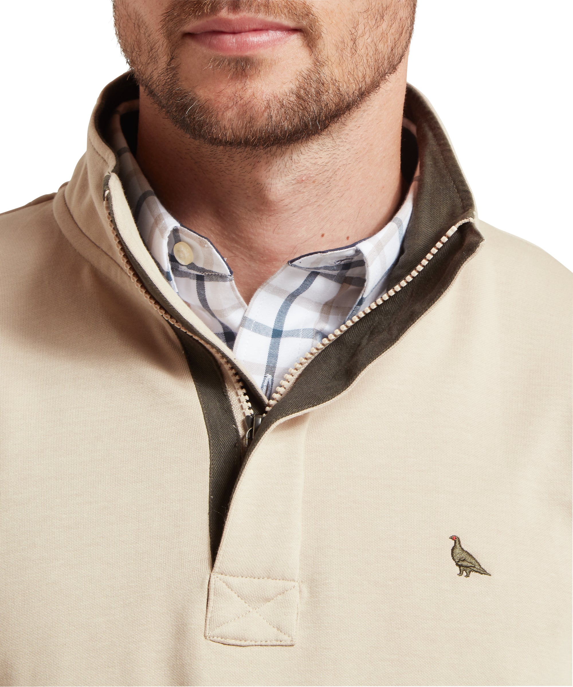 Beige sweatshirt with plaid shirt underneath on a white background