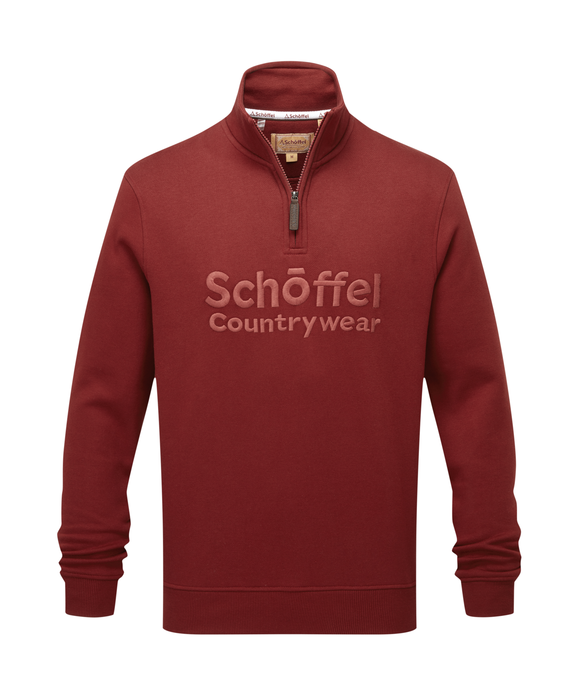 Red sweater with 'Schöffel Countrywear' logo on a white background