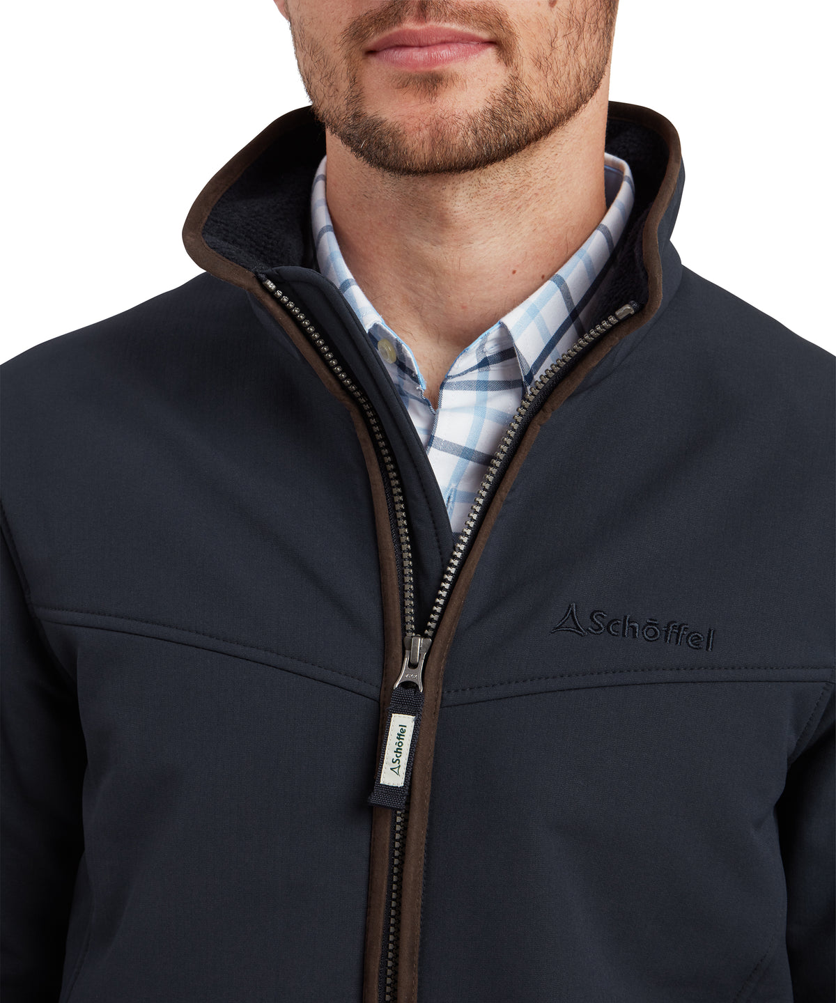 Dark navy blue schoffel fleece burrough jacket with brown zipper and collar trim for outdoor warmth