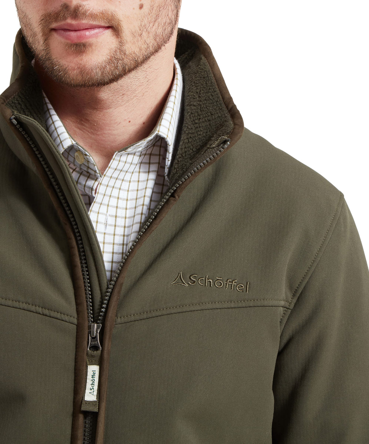 A closer look at the logo detail on the Schöffel Burrough Jacket in Green, comfortable warm fabric