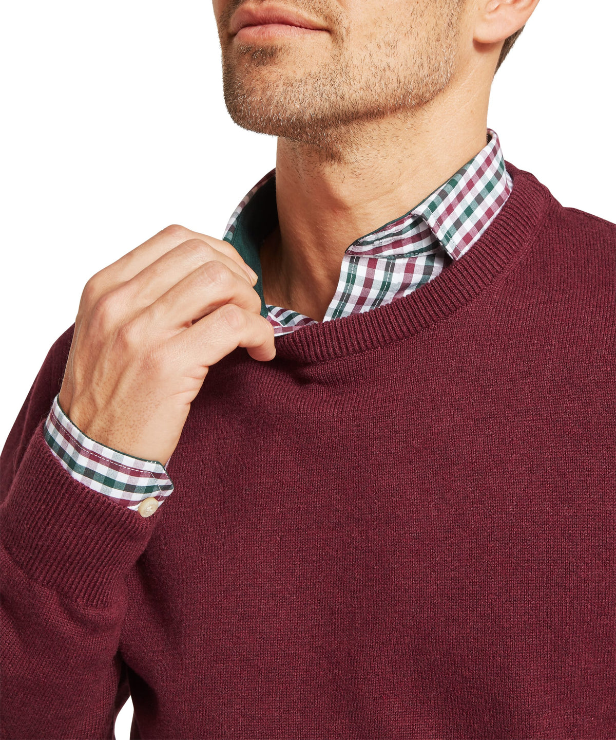 Calton cotton cashmere crew jumper in burgundy with ribbed cuffs worn over a plaid button down shirt