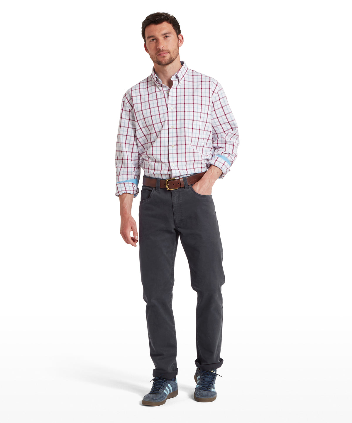 Man wearing Canterbury charcoal 5 pocket jeans with rolled-up sleeves plaid shirt showing front side