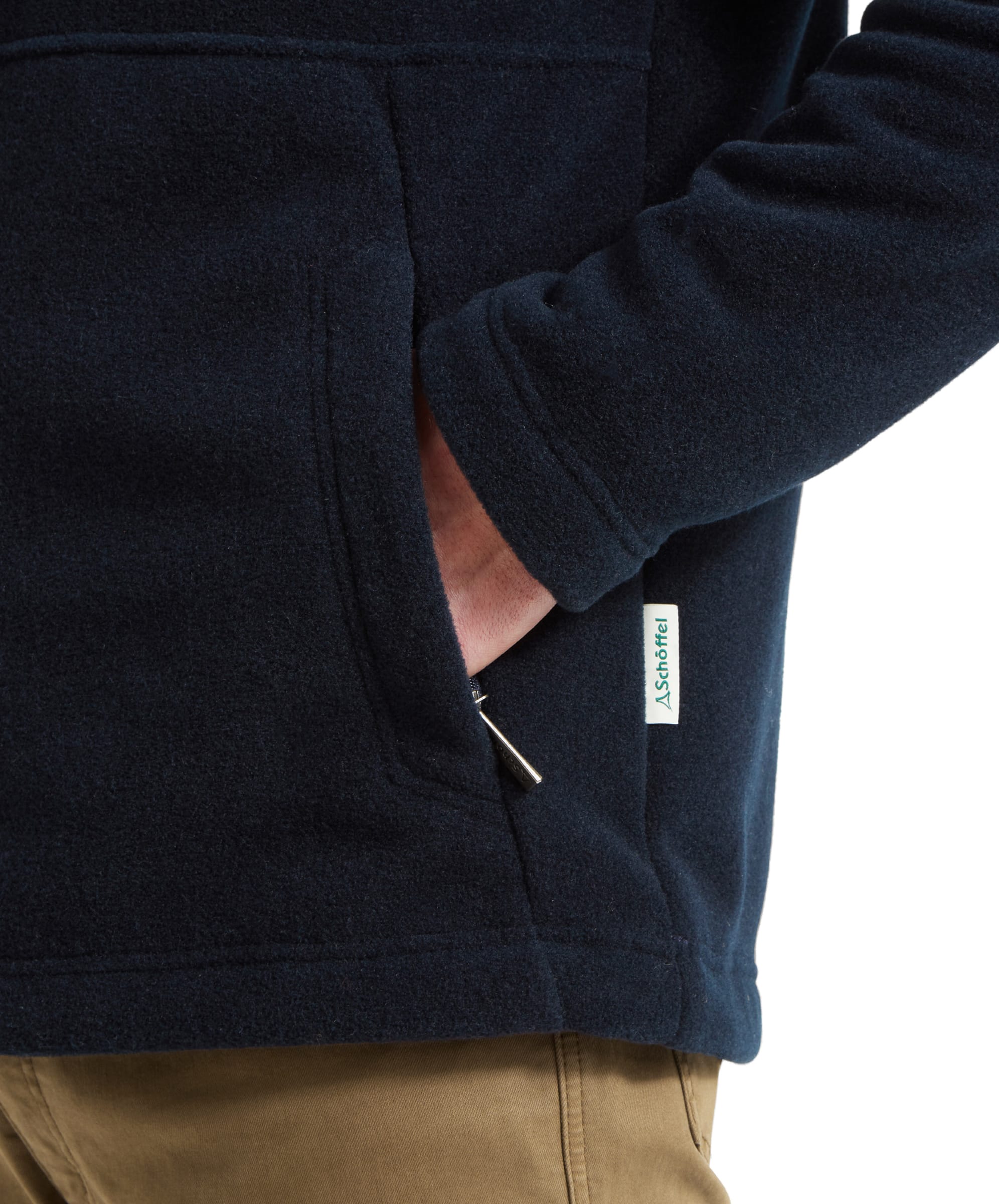 Close-up of the pocket detail on Schöffel Cottesmore Fleece Jacket for Men in Navy, featuring the Schöffel logo.