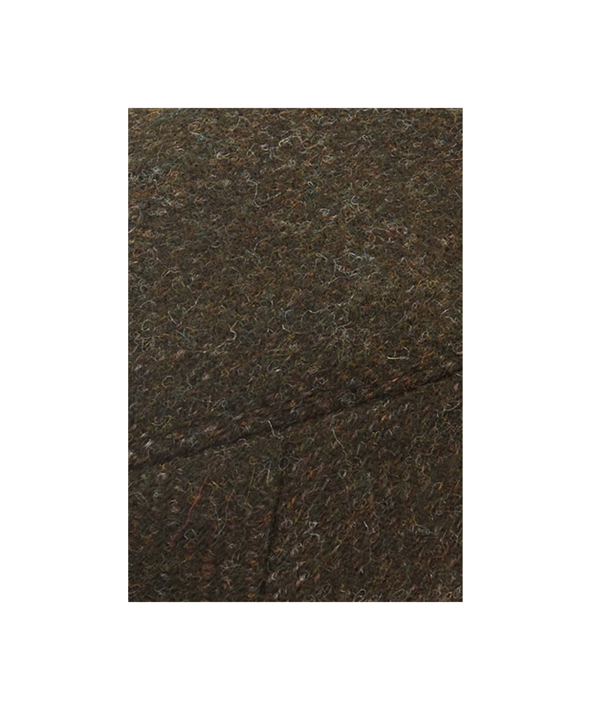 Close up of a Men's Countryman tweed cap
