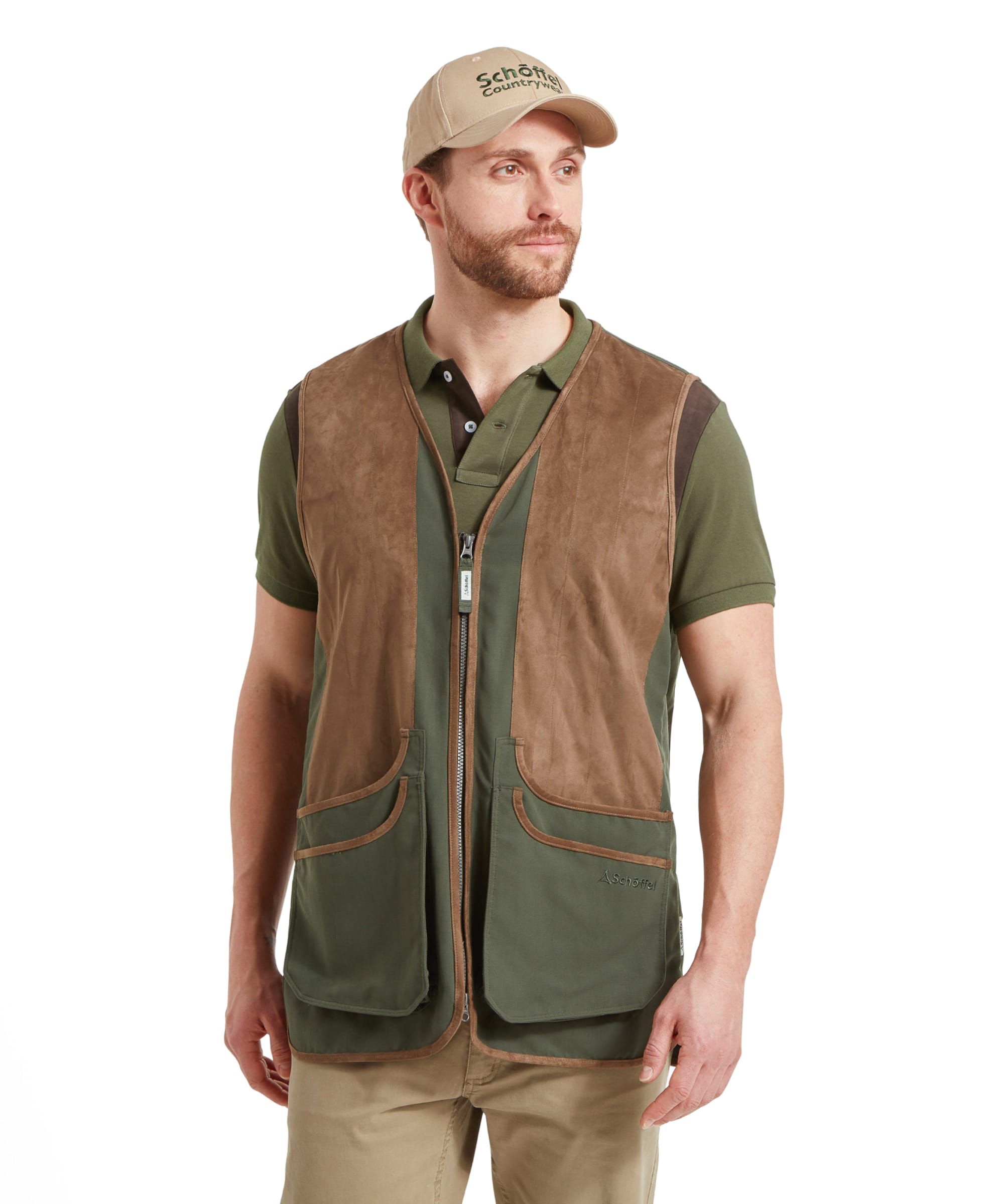 Schöffel Men's Grimsthorpe Clay Shooting Vest in Green — front view showing suede shooting patches, full-length zip and cartridge pockets, styled with a polo shirt, khaki chinos and a Schöffel cap
