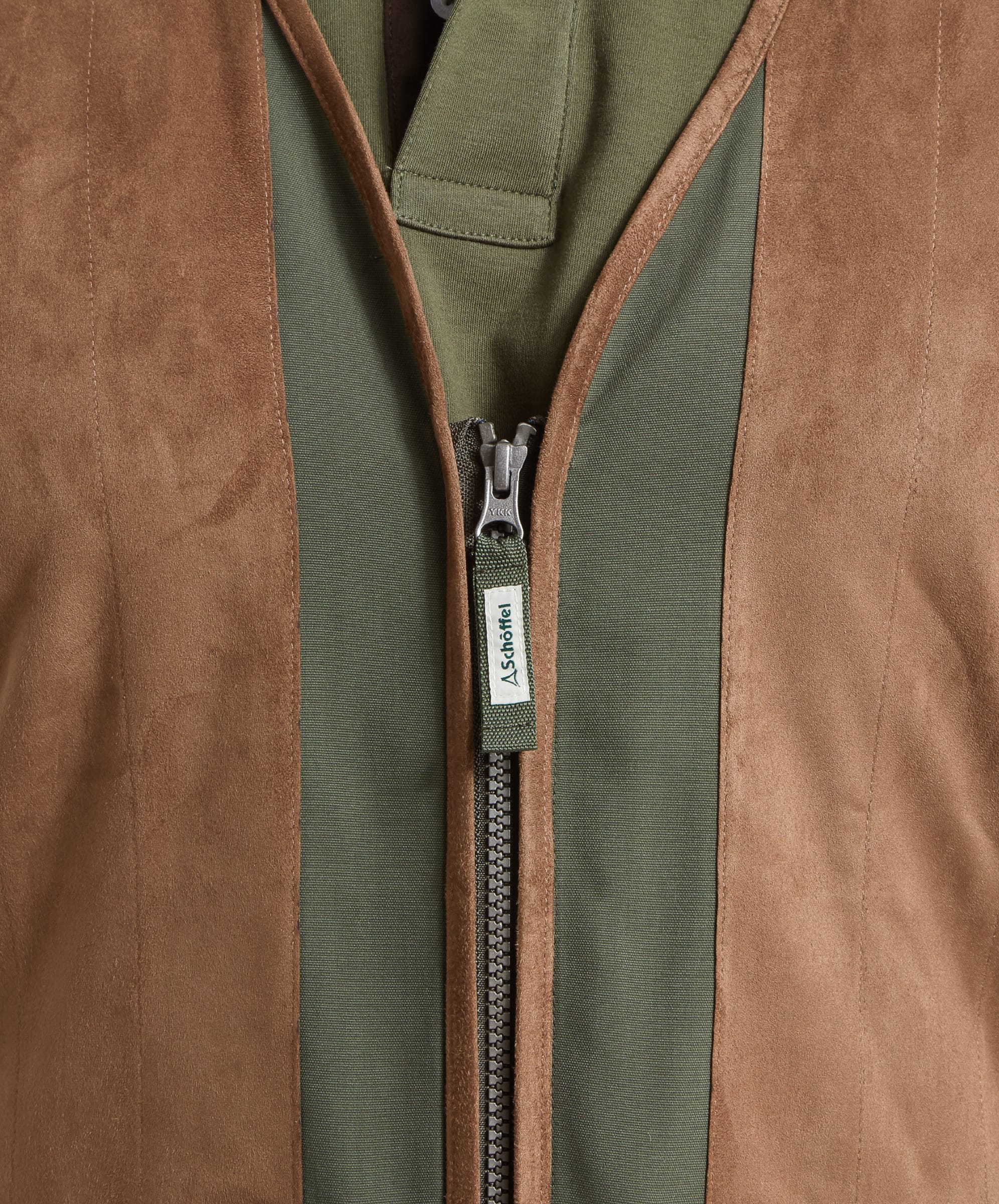 Schöffel Men's Grimsthorpe Clay Shooting Vest in Green — close-up of full-length zip with Schöffel branded pull tab and contrast suede front panel detail
