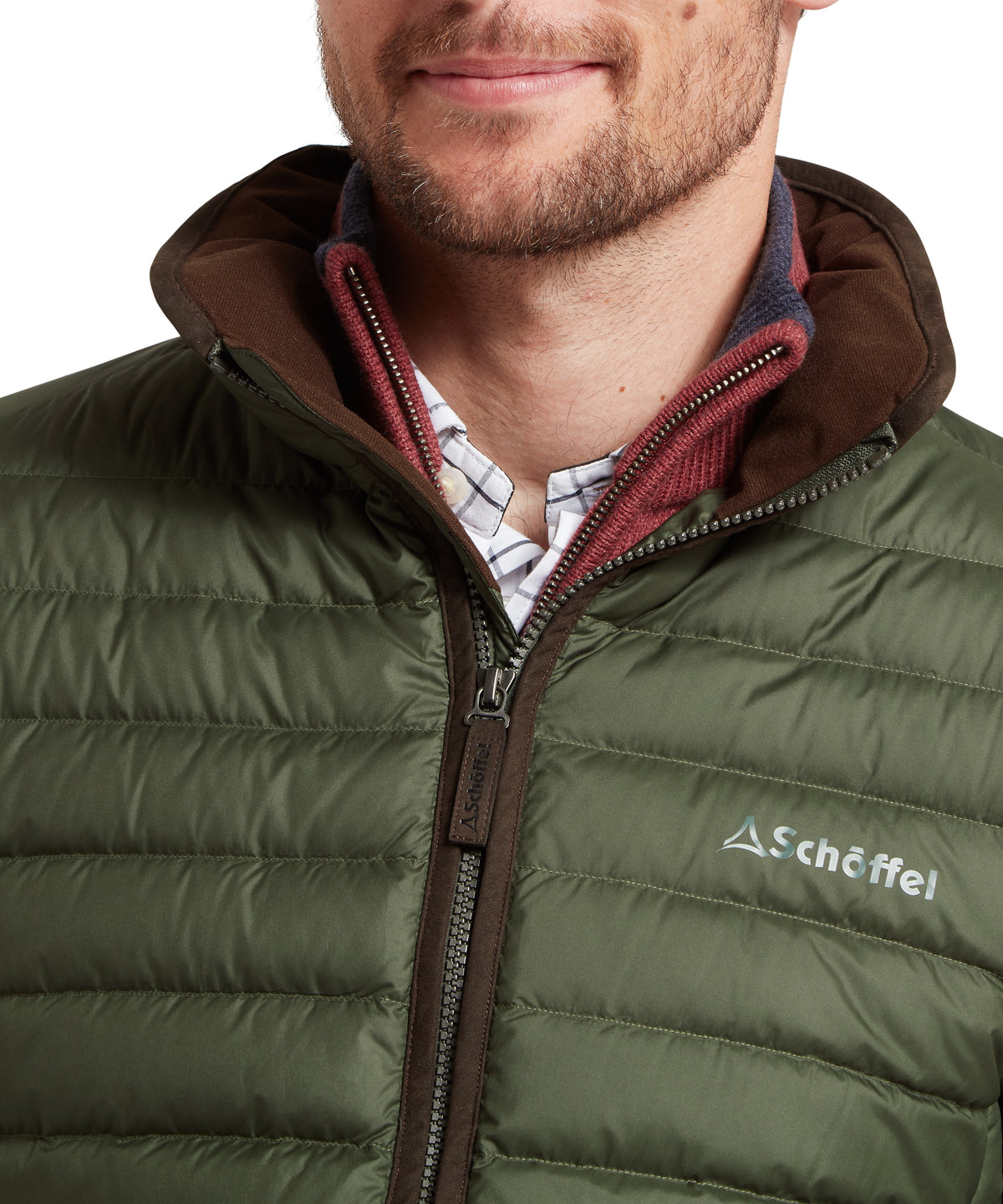 Model wearing the Schöffel Hallaton Down Jacket in Green, schöffel logo on chest