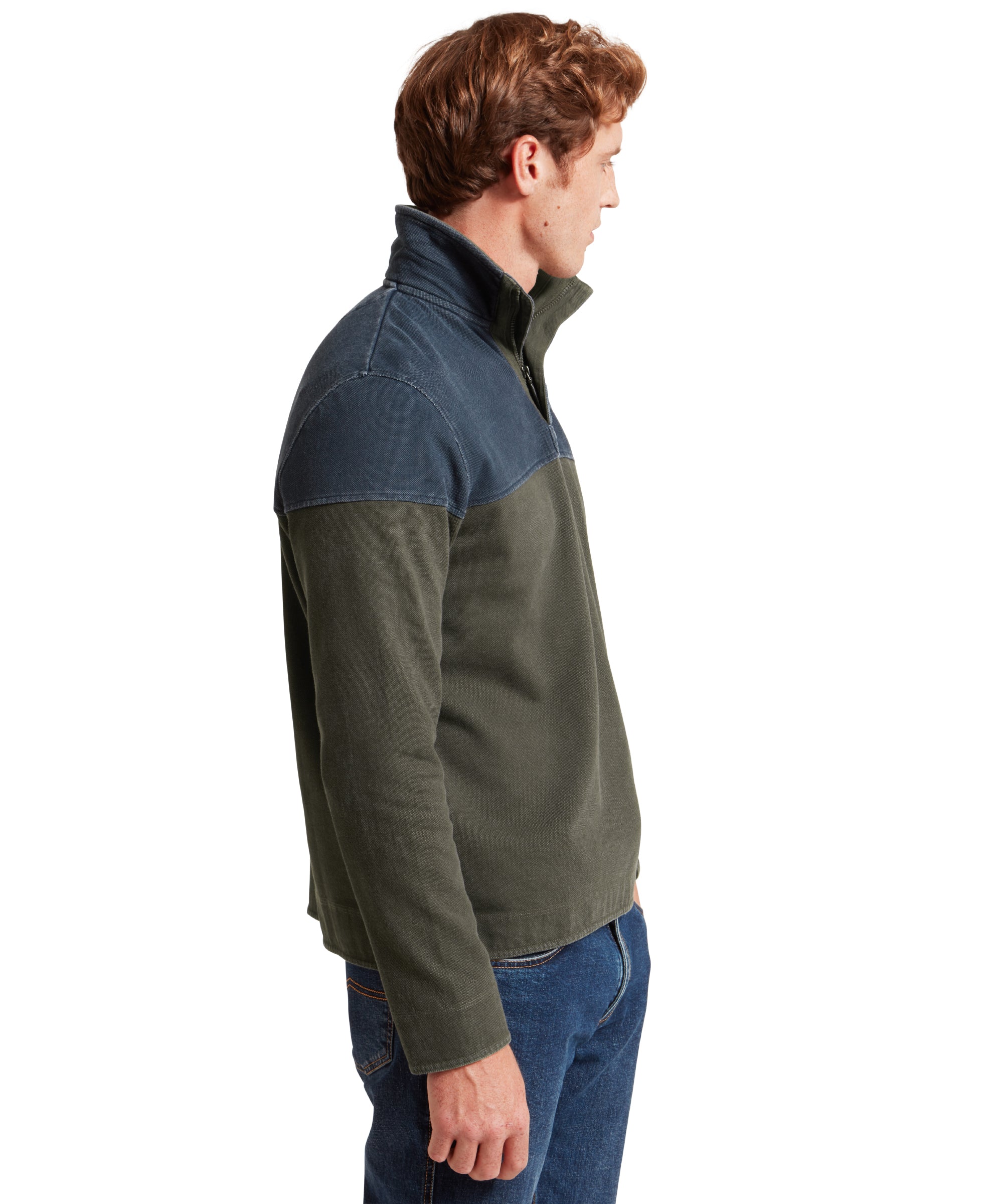 Man wearing a two-tone sweatshirt with blue and green colours on a white background