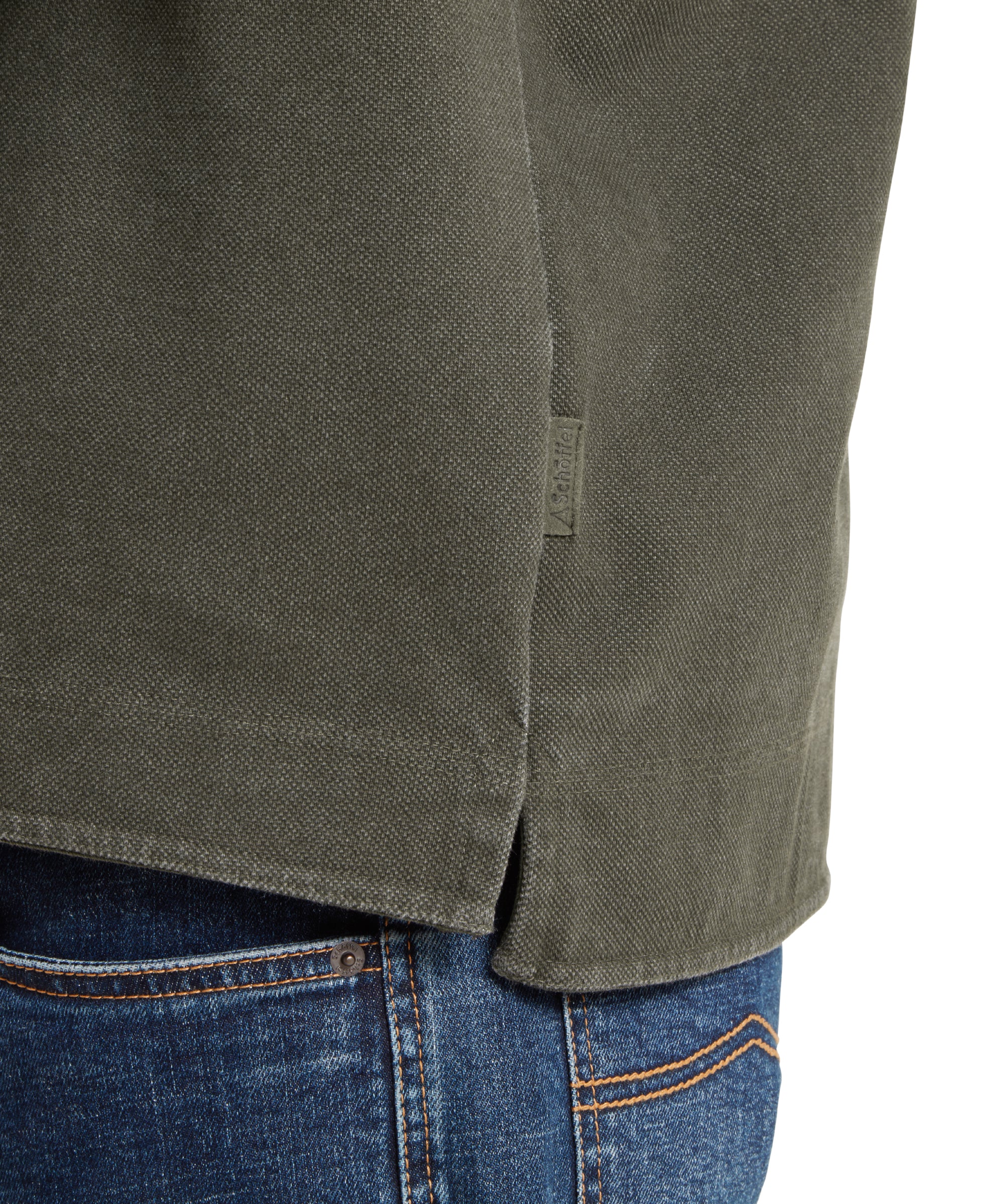 Close-up of a green sweatshirt and blue jeans on a white background