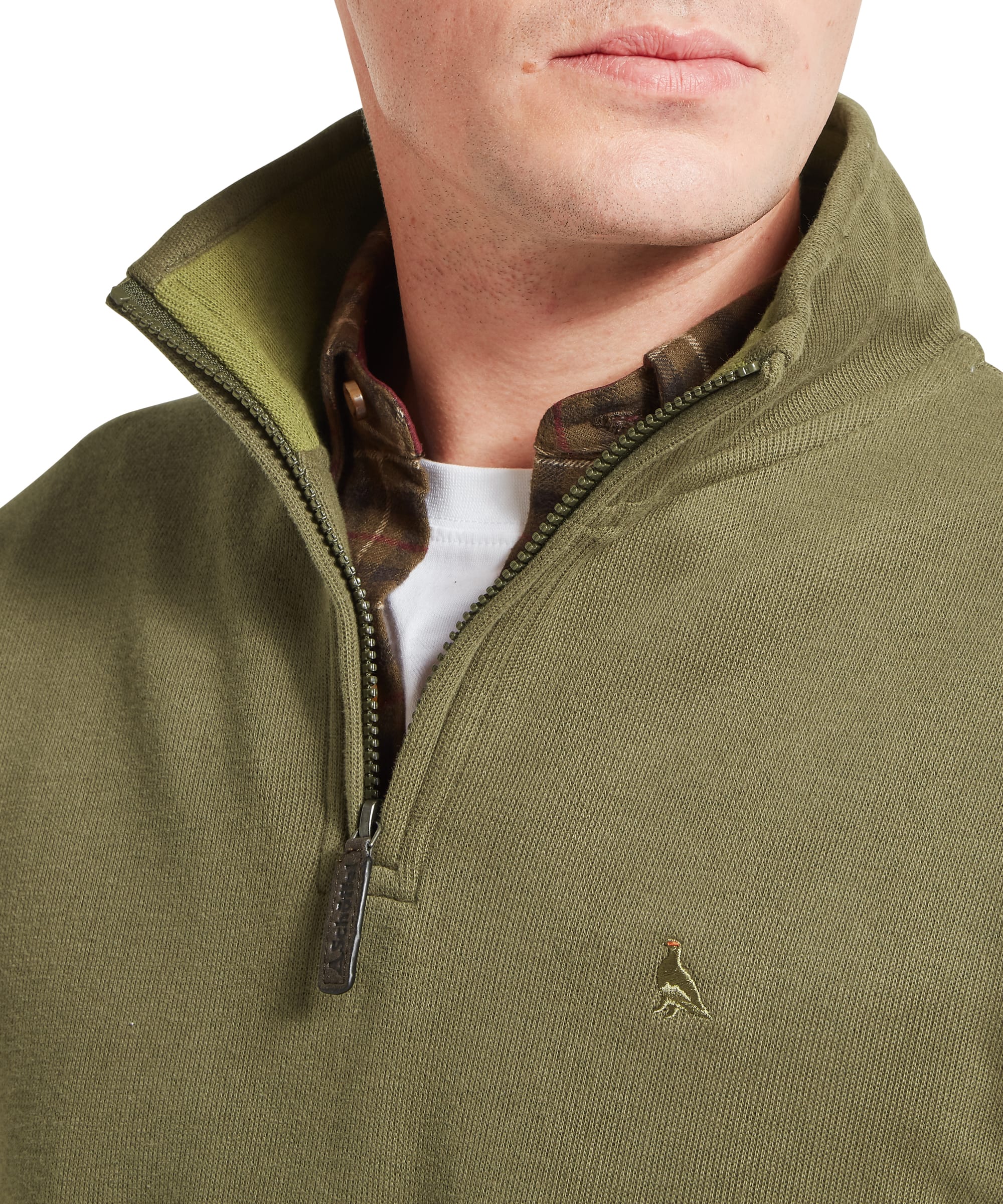 Close-up of Schöffel Men's Kingsand Quarter-Zip Jumper in olive green showing quarter-zip neck with Schöffel branded leather zip pull, contrast tartan inner collar lining and embroidered pheasant chest logo