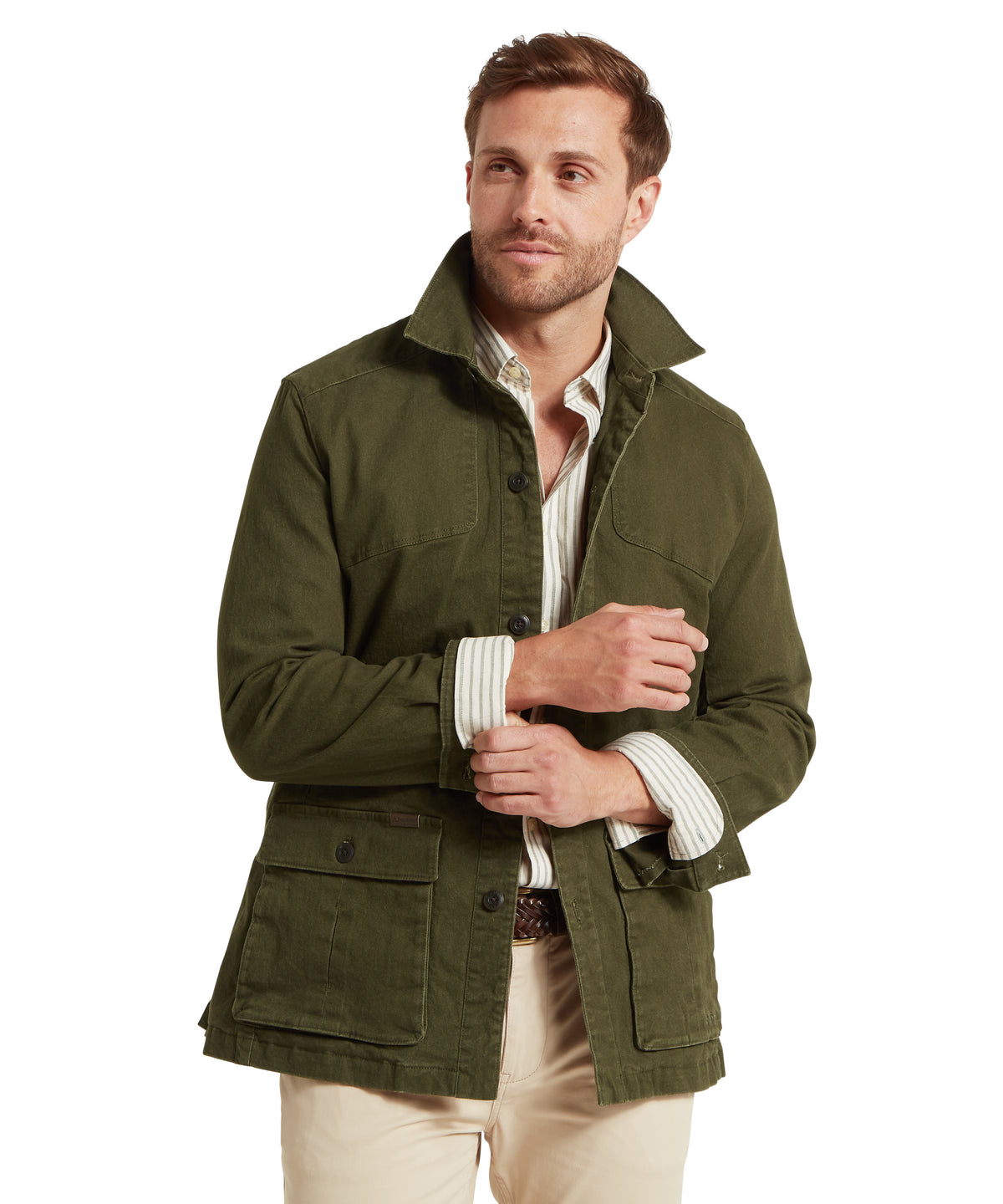 Olive green canvas lynmouth utility jacket with buttoned flap pockets and collar in woodland style