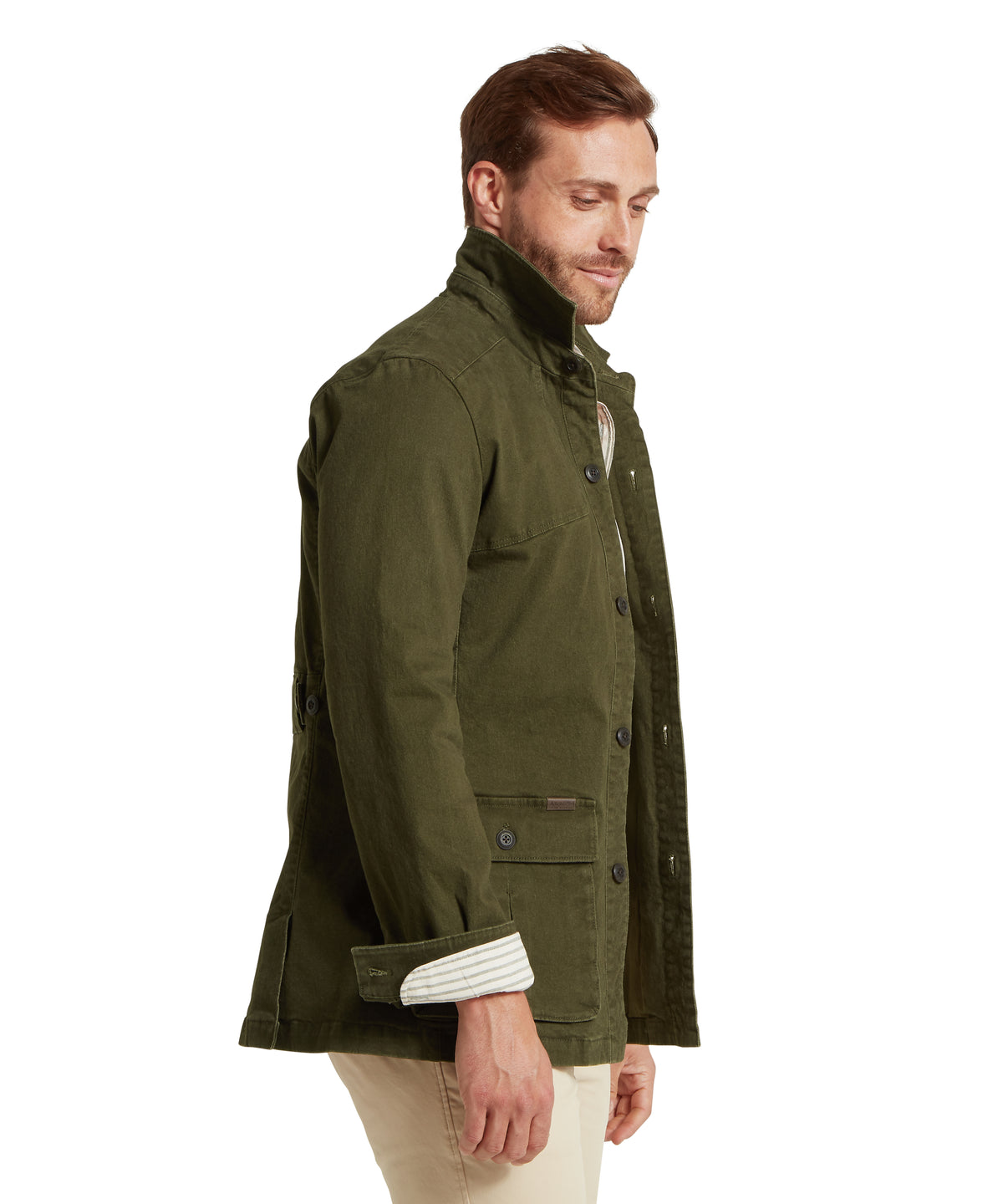 Model wearing the Schöffel Lynmouth Utility Jacket in Green, striped inner lining in woodland style