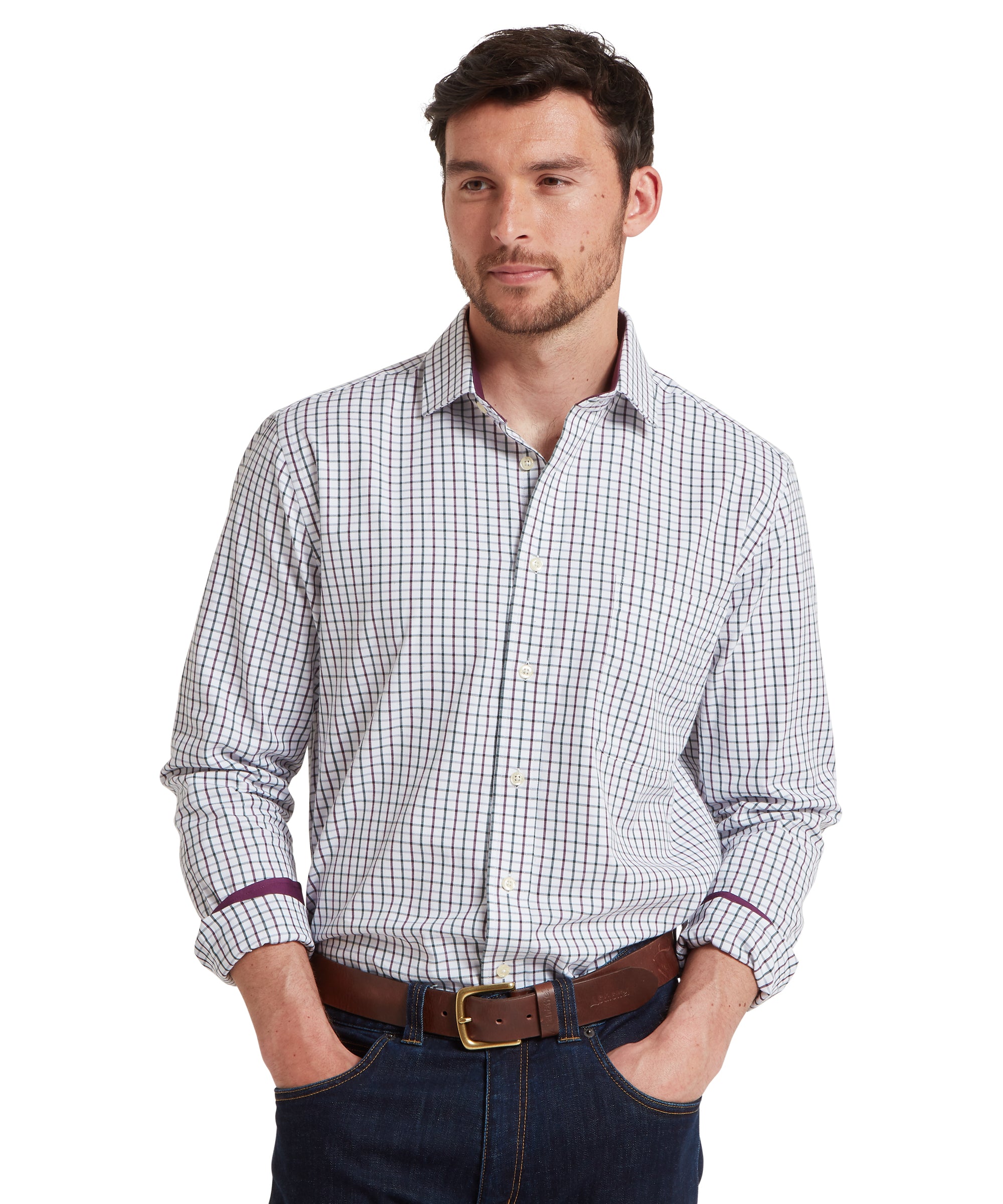 Man wearing a checkered shirt with rolled-up sleeves on a white background