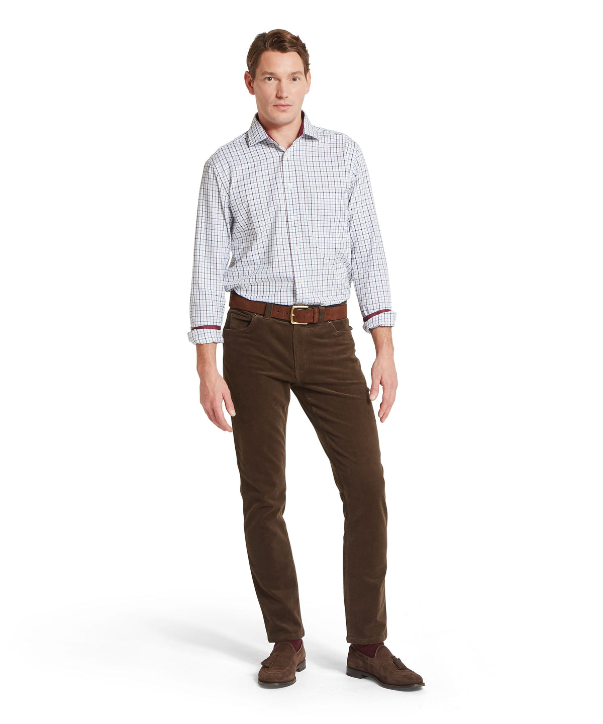 Brown corduroy trousers with subtle ribbed texture and matching belt paired with milton tailored