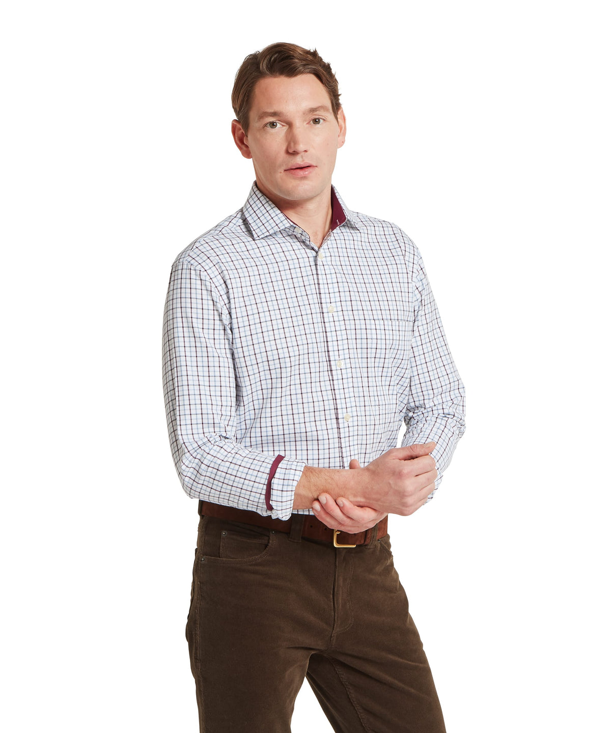 Model wearing the Schöffel Milton Tailored Shirt in Blue, cuff trim, maroon collar