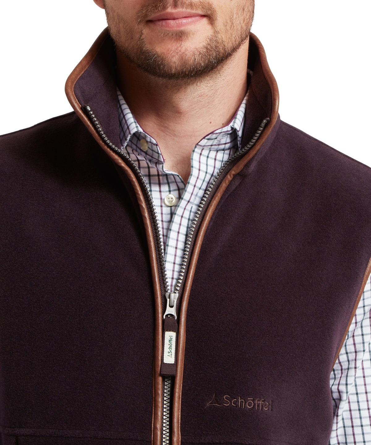 Dark purple oakham fleece gilet with brown leather trim and schöffel branded zipper pull