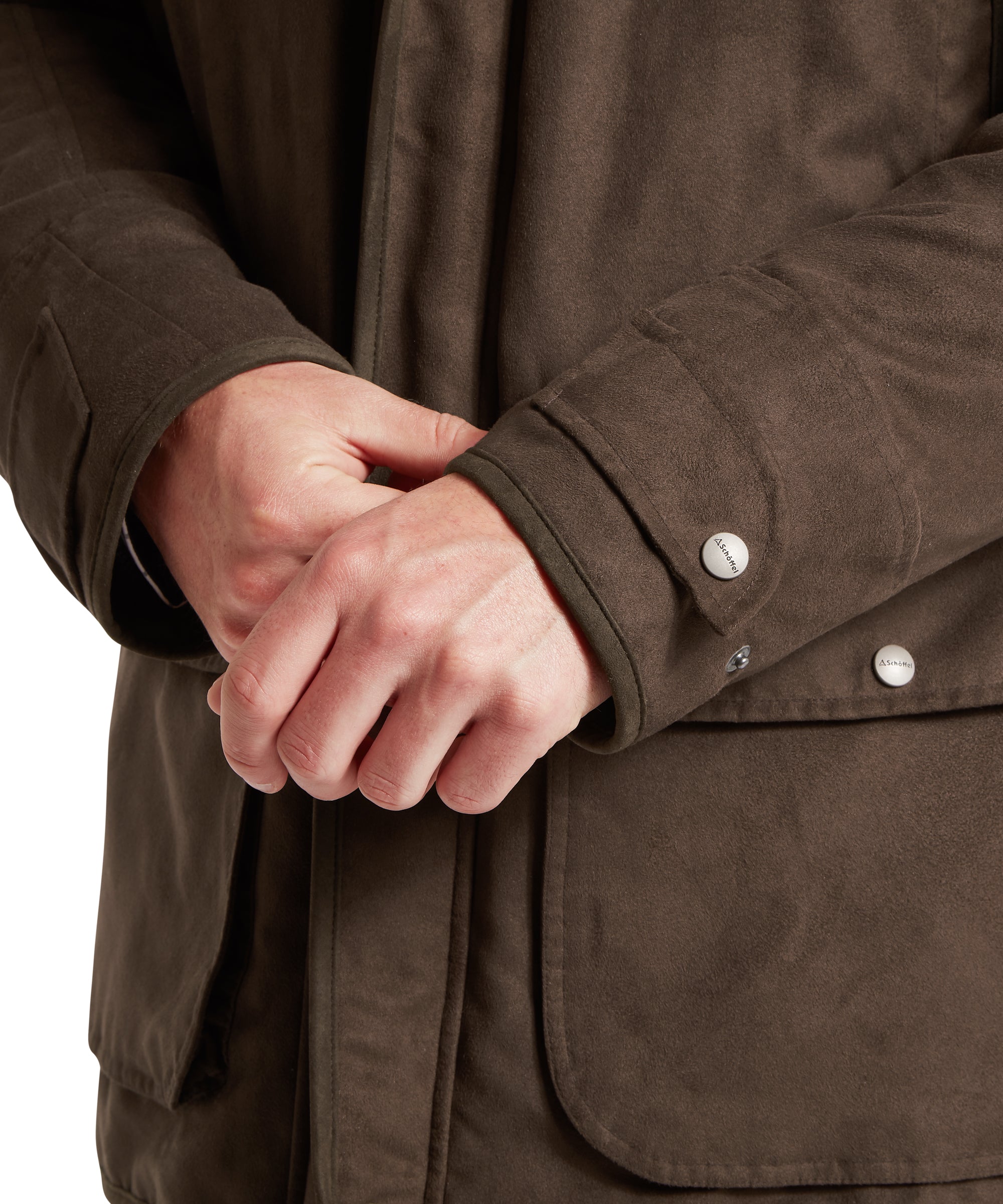 Close-up of a brown jacket with a hand adjusting the sleeve