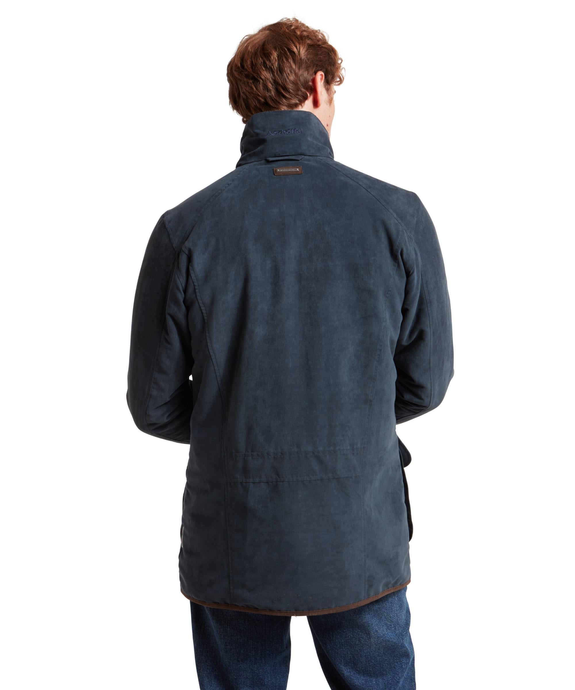 Man wearing a blue jacket on a white background