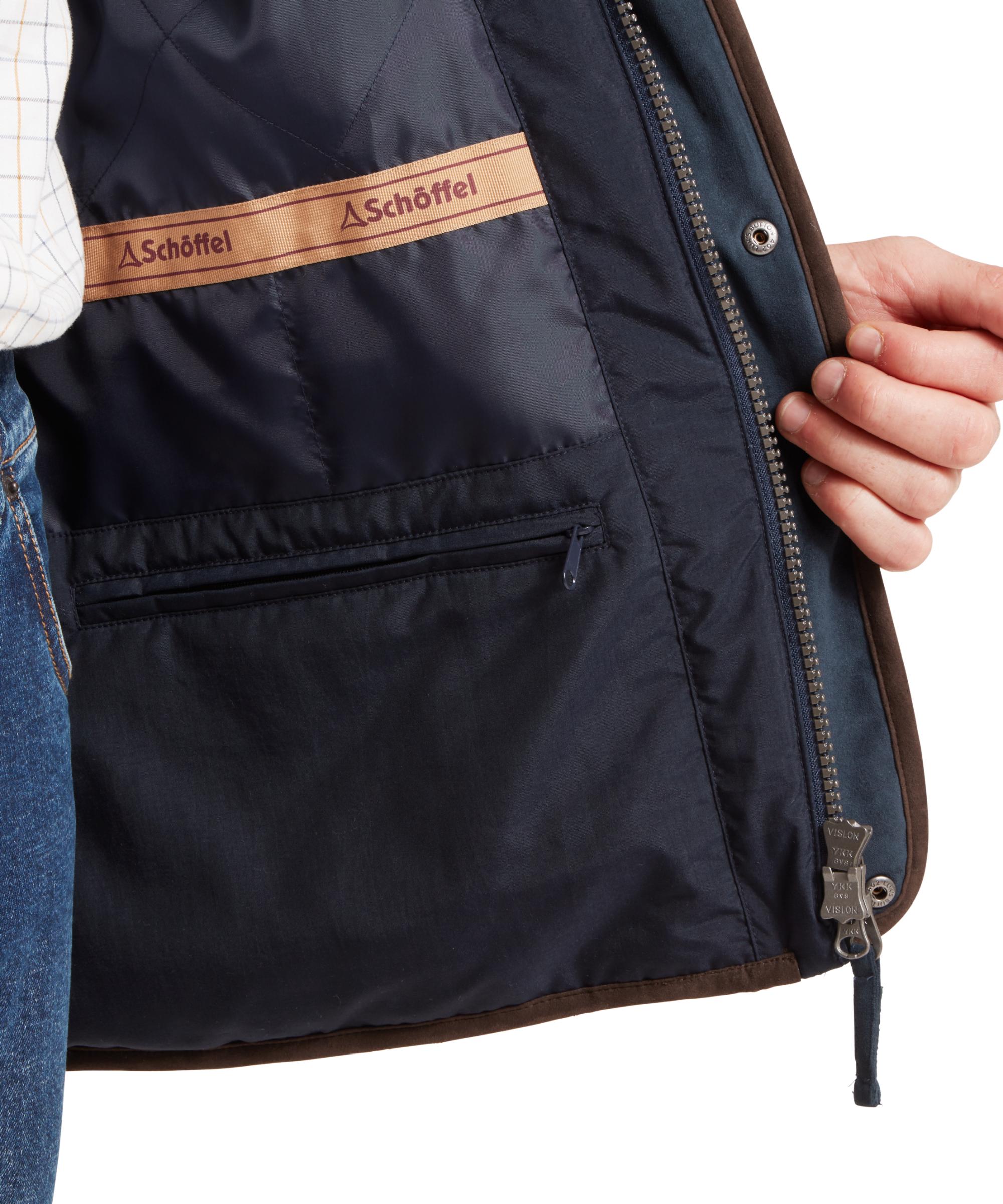 Navy blue vest with brown accents and Schöffel branding on a white background