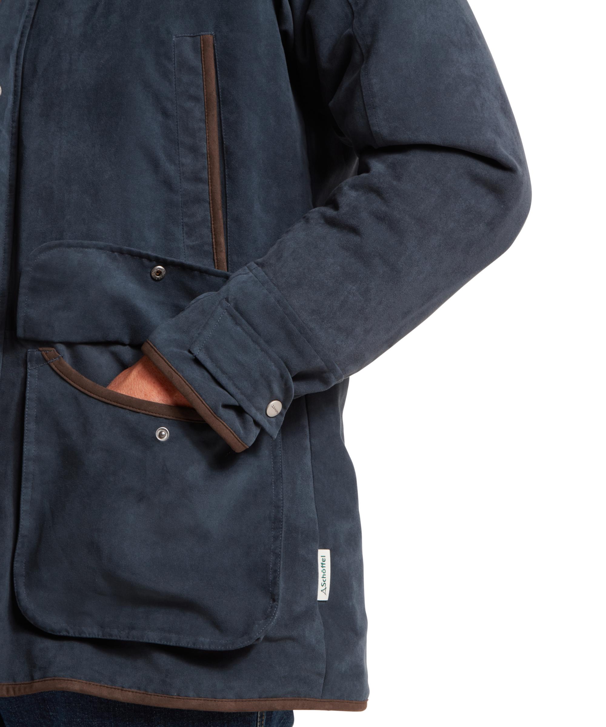 Navy blue jacket with brown accents on a white background