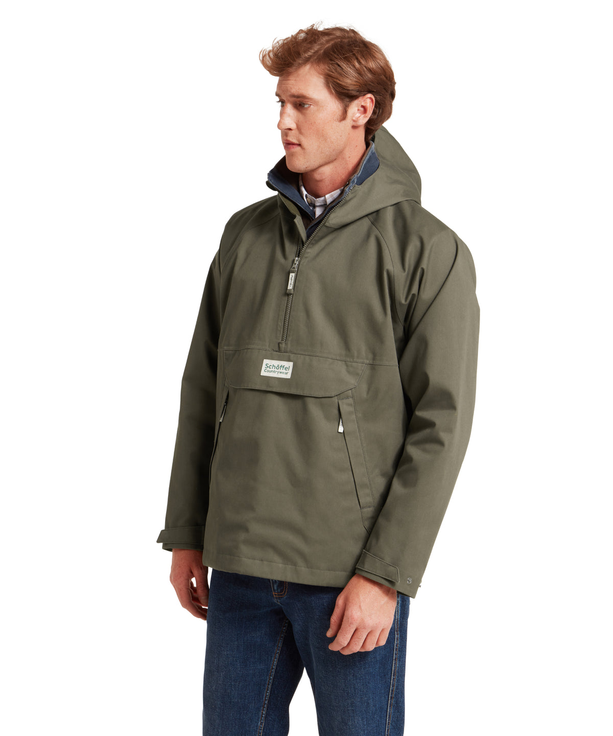 Schöffel's Overton Waterproof Anorak in Green, on model, chest pocket featuring Schaefer logo