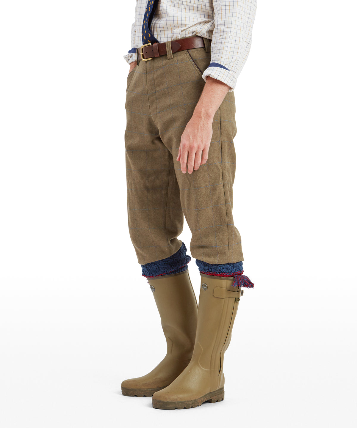 Model wearing the Schöffel Ptarmigan Tweed Plus Twos in Brown, red fringe detail