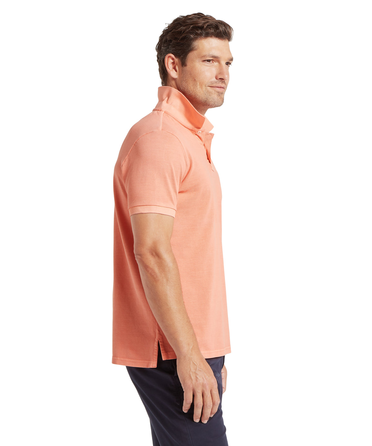 A coral peach short-sleeved polo shirt with a classic collar and side slits from st ives garment