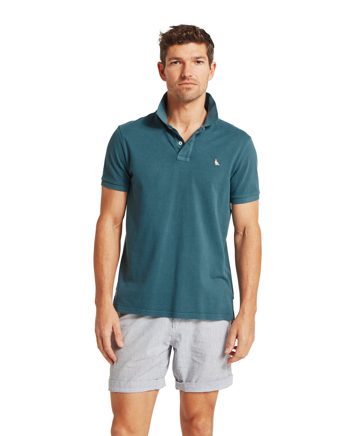 St Ives garment dyed polo shirt in deep ocean blue with a small embroidered bird logo on the left