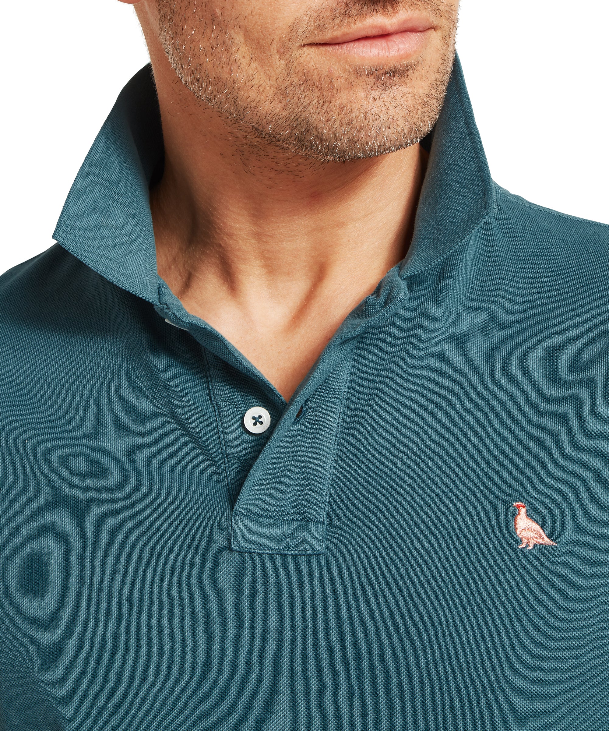 Teal pique st ives garment dyed polo shirt with small embroidered bird logo on left chest in deep