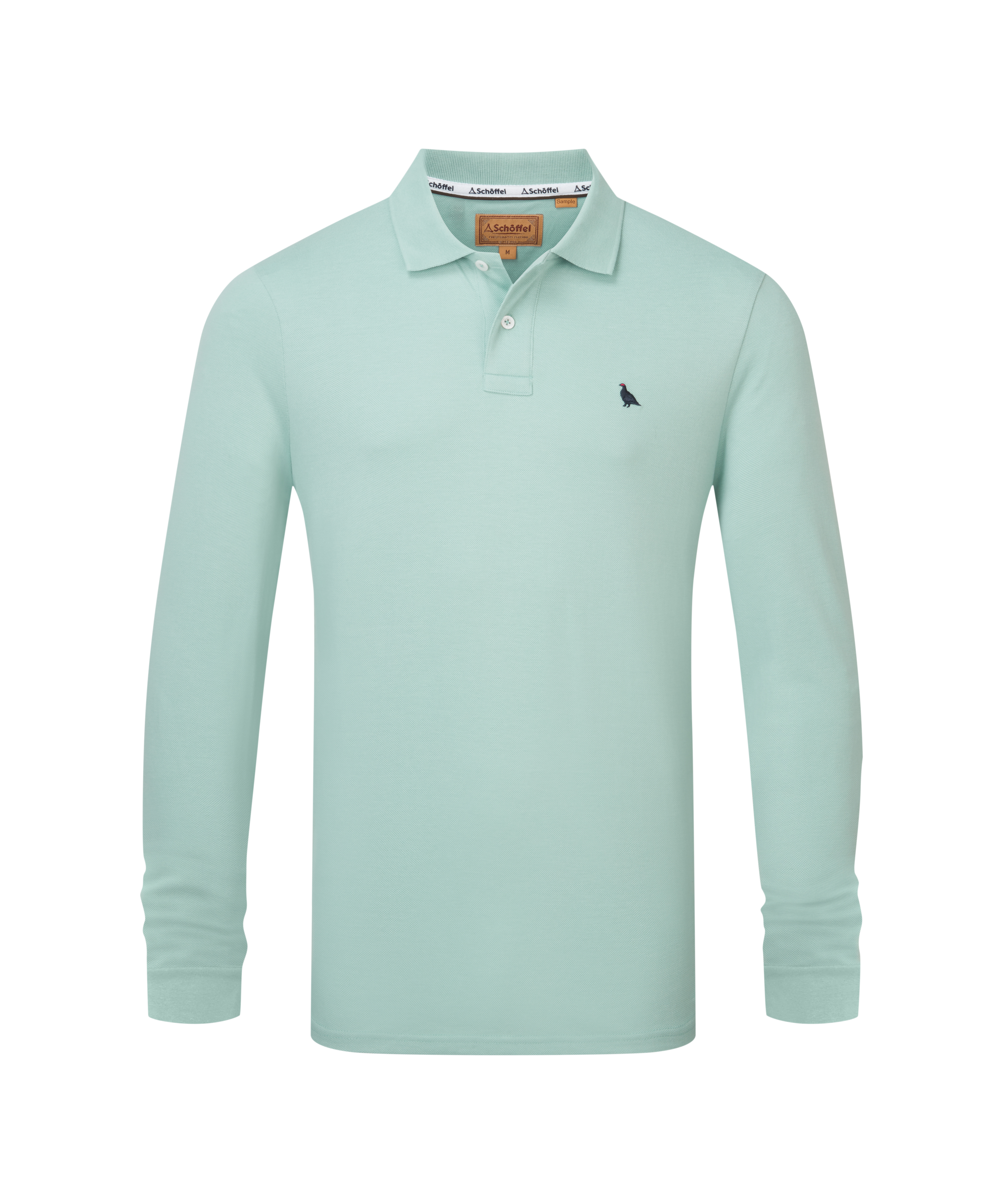A mint green St Ives long sleeve polo shirt with a black bird emblem and an orange brand tag at