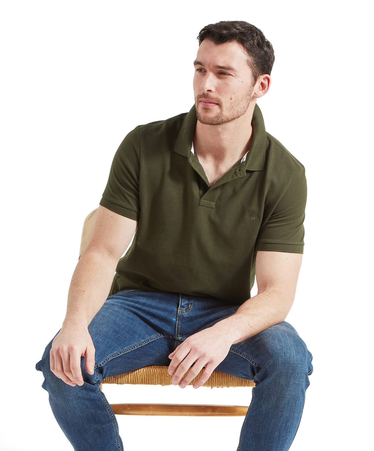 Schöffel's St Ives Polo Shirt in Green, on model, subtle brand logo on chest